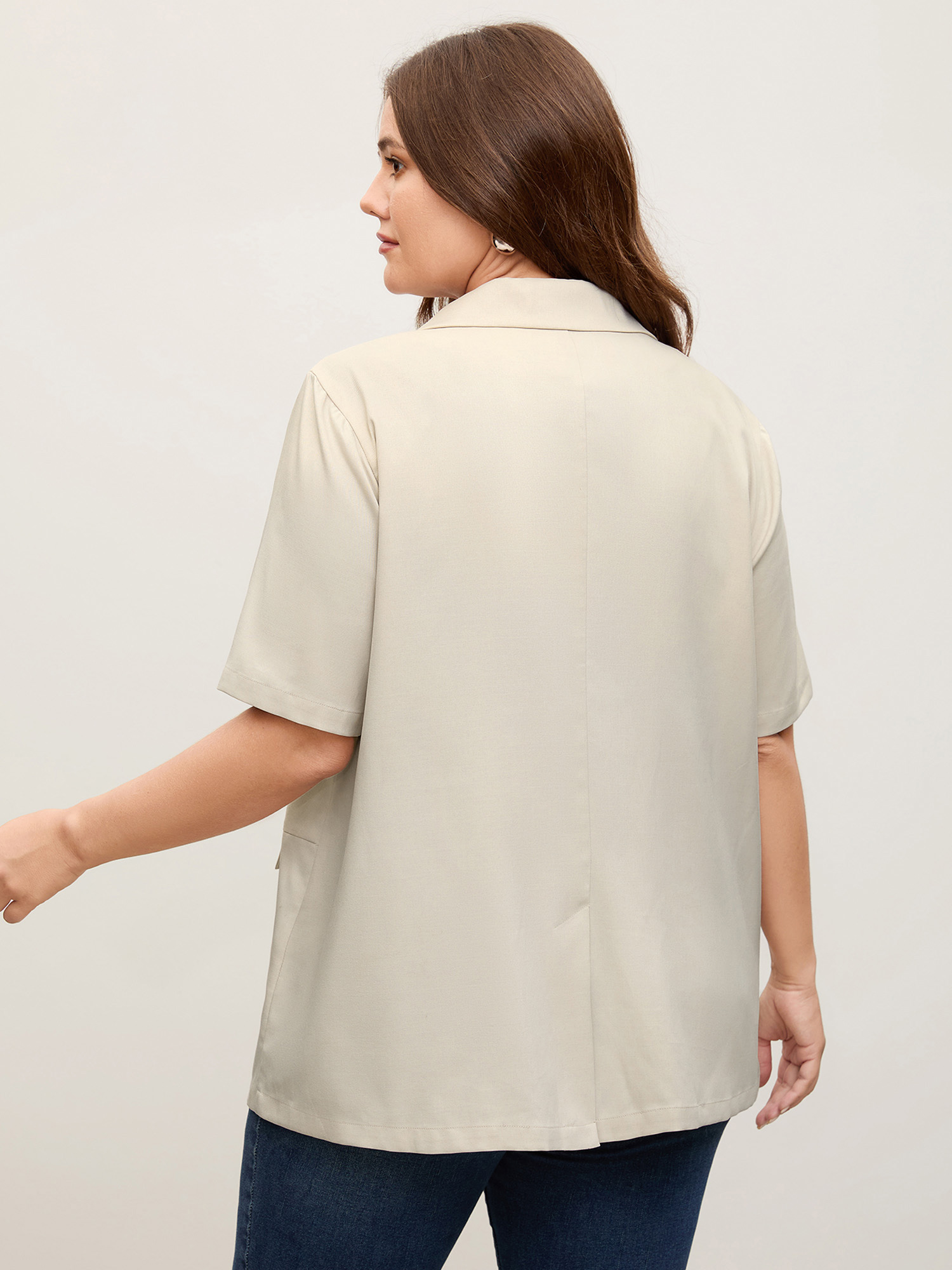 Side view of BloomChic Women's Plus Size Short Sleeve Pockets Solid Blazer Apricot Button Sleeve Short sleeve 12/L