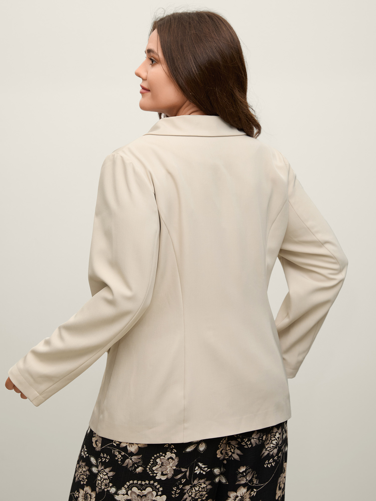Side view of BloomChic Women's Plus Size Button Front Pockets Solid Blazer Champagne Button Sleeve Long Sleeve 12/L