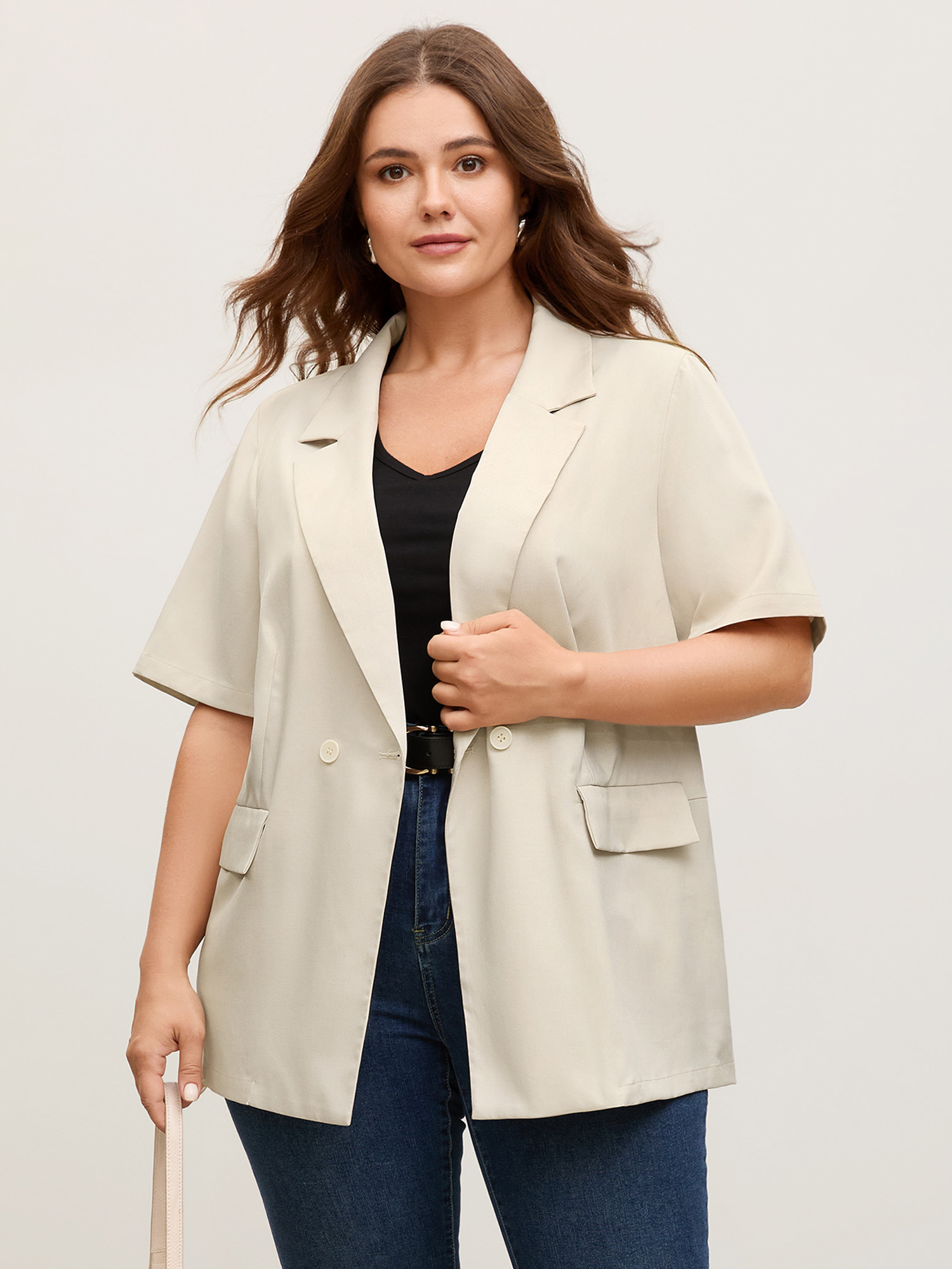 Side view of BloomChic Women's Plus Size Short Sleeve Pockets Solid Blazer Apricot Button Sleeve Short sleeve 12/L