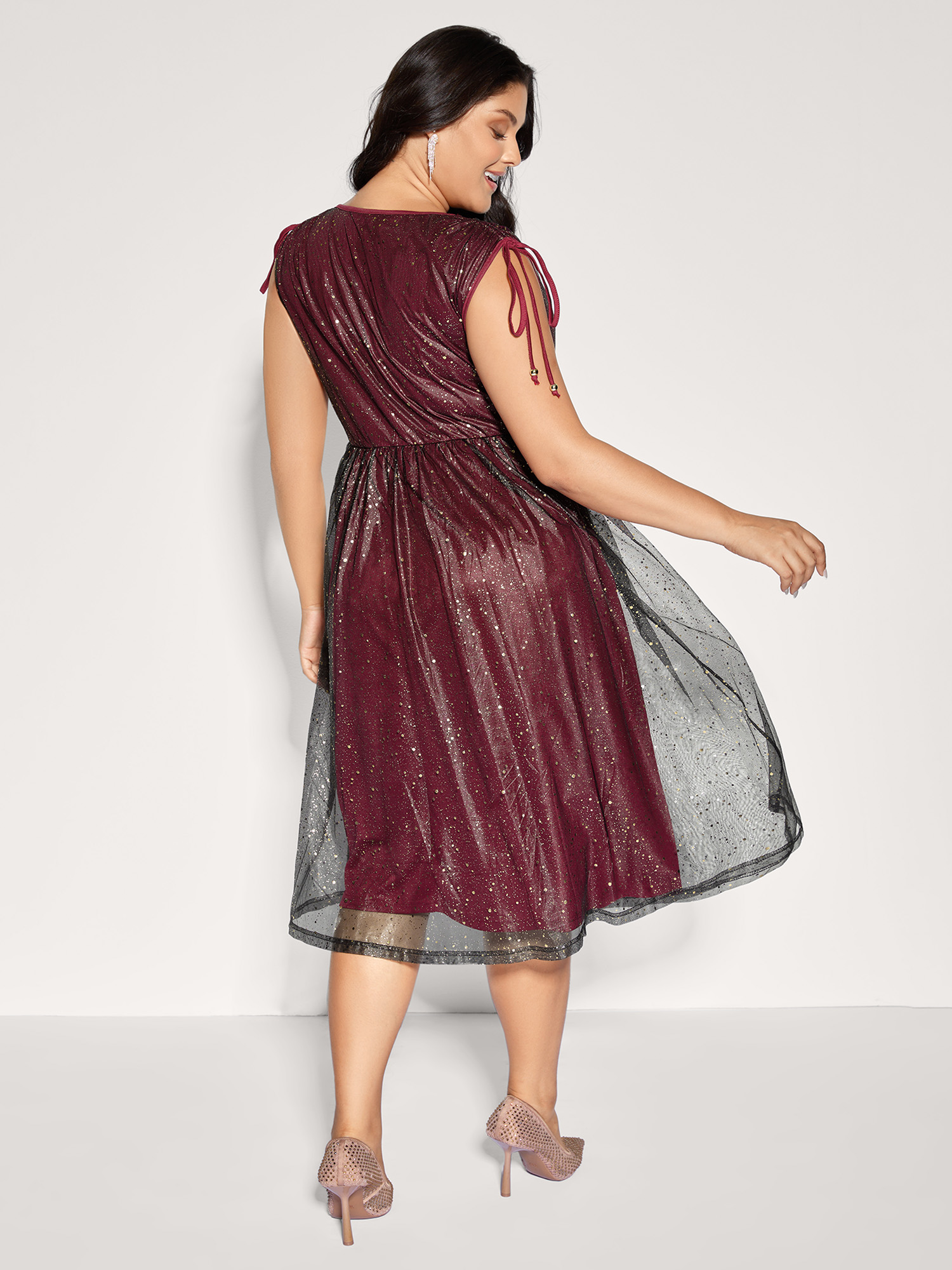 Side view of BloomChic Women's Plus Size Shimmery Sequin Rhinestones Shoulder Tie Midi Dress Burgundy Party Midi Drawstring 10/M