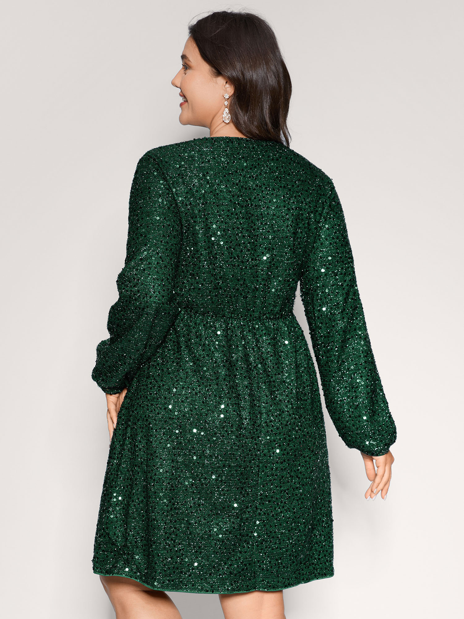 Side view of BloomChic Women's Plus Size Shimmery Sequin V-Neck Knee Dress DarkGreen Party Smocked V-Neck 12/L