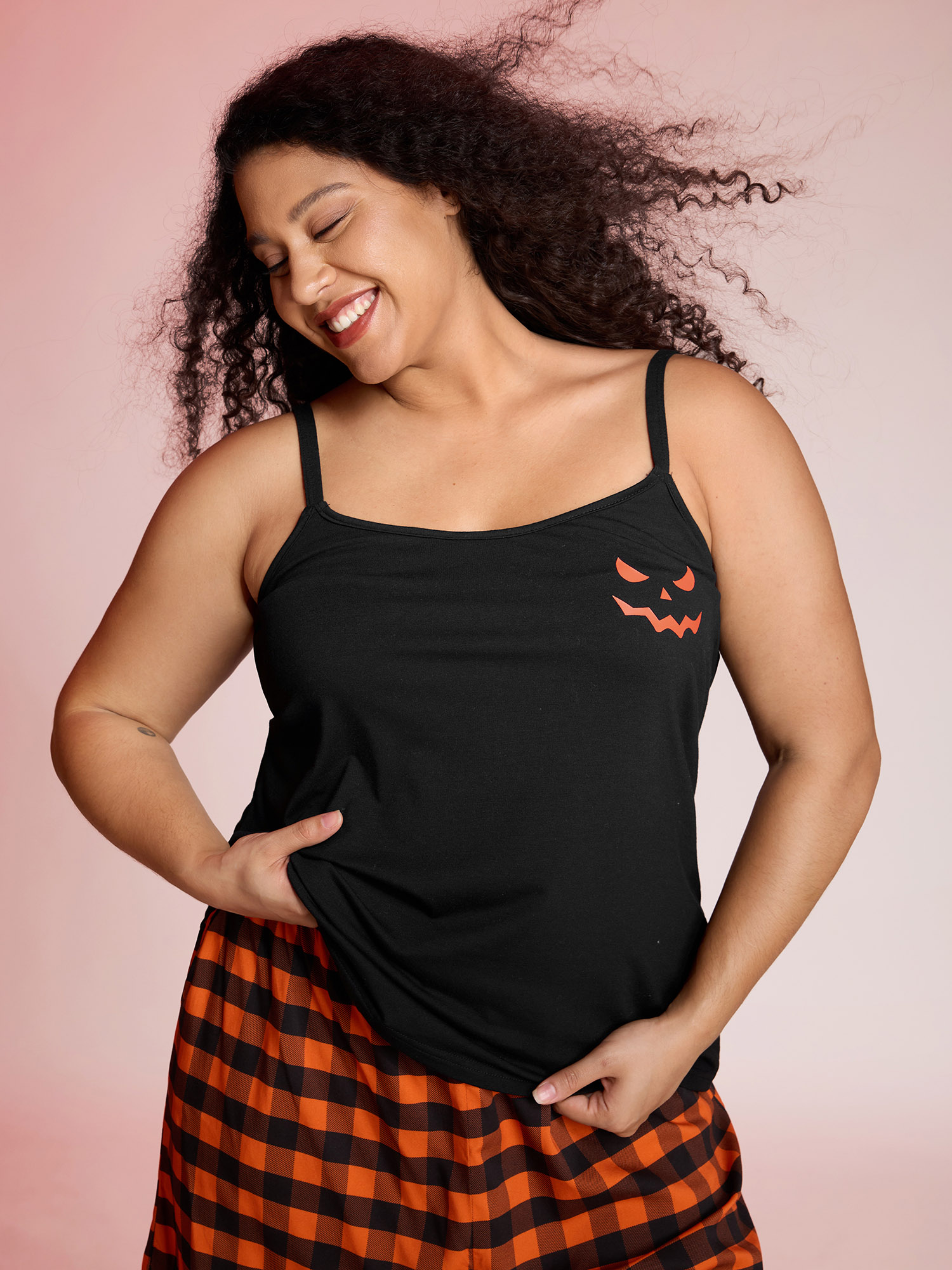 Side view of BloomChic Women's Plus Size Halloween Stretchy Plaid Contrast Pajama Set Black Graphic-Halloween 10/M