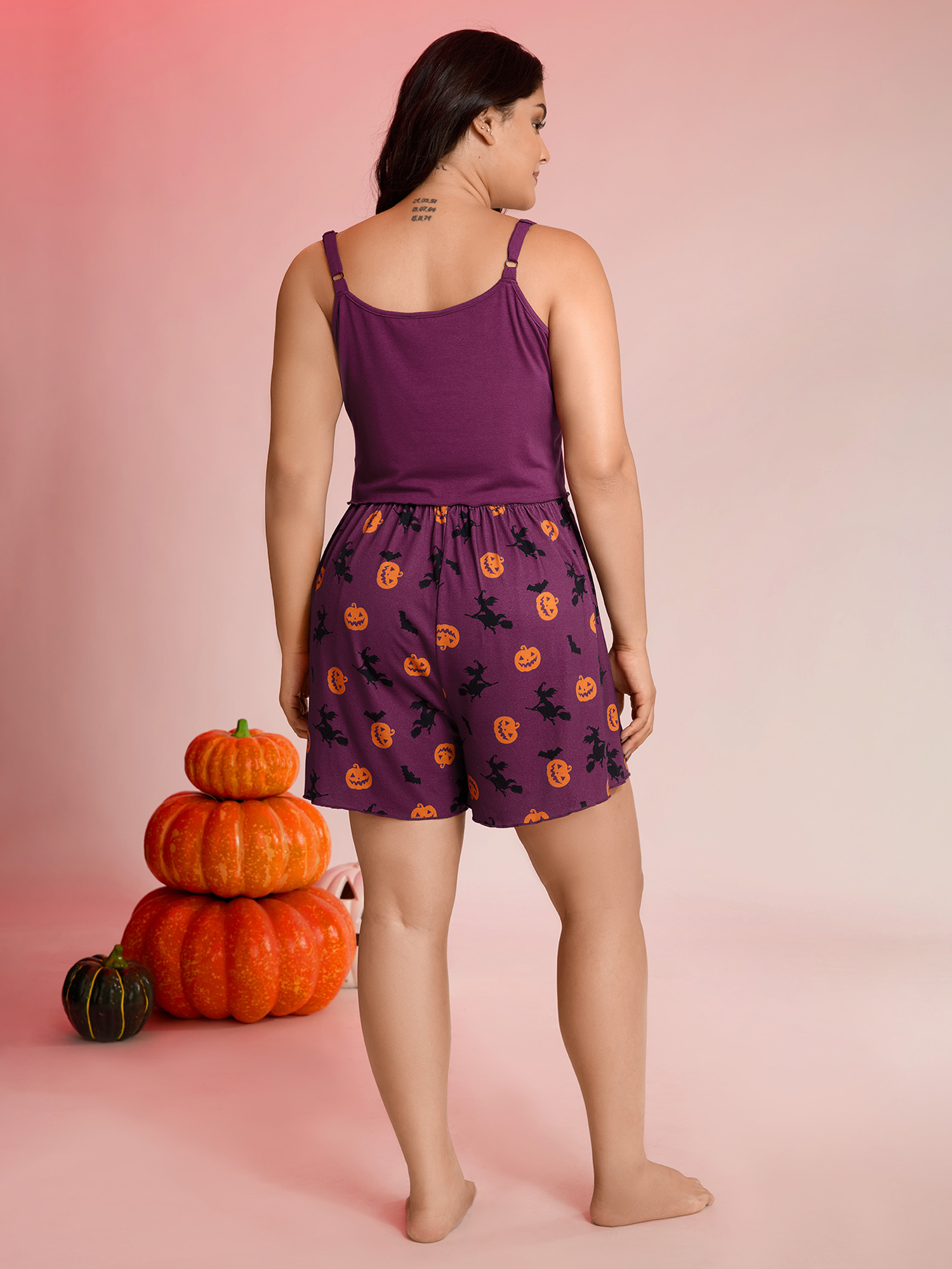 Side view of BloomChic Women's Plus Size Halloween Print Stretchy Waist Pajama Set Deeppurplered 10/M
