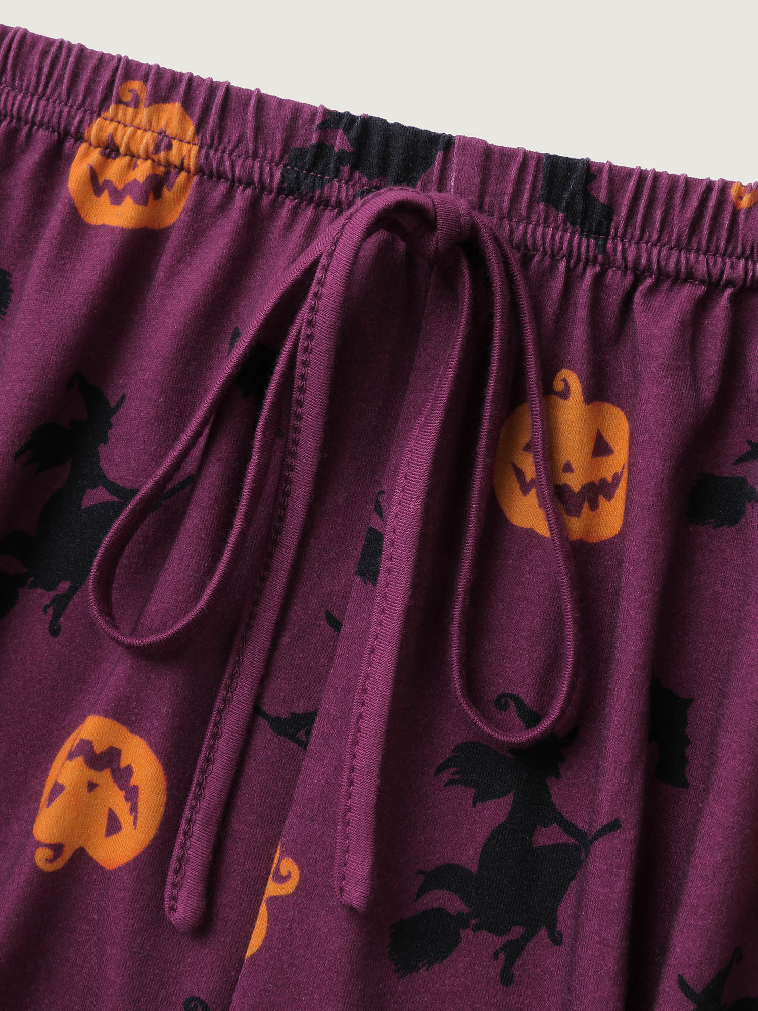 Side view of BloomChic Women's Plus Size Halloween Print Stretchy Waist Pajama Set Deeppurplered 10/M