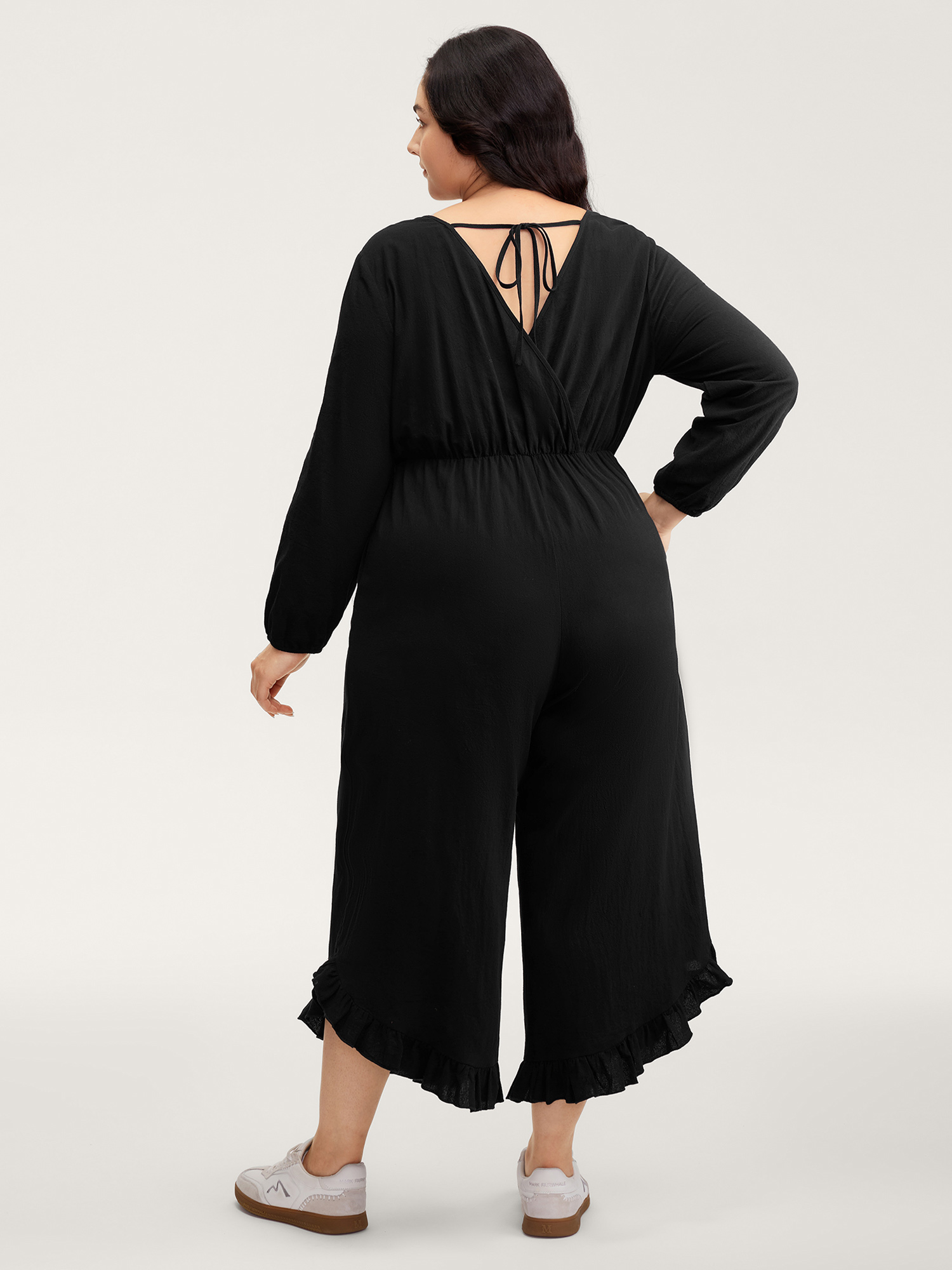 Side view of BloomChic Women's Plus Size Pure Cotton Ruffled Hem Pockets Jumpsuit Black Casual 30/6X