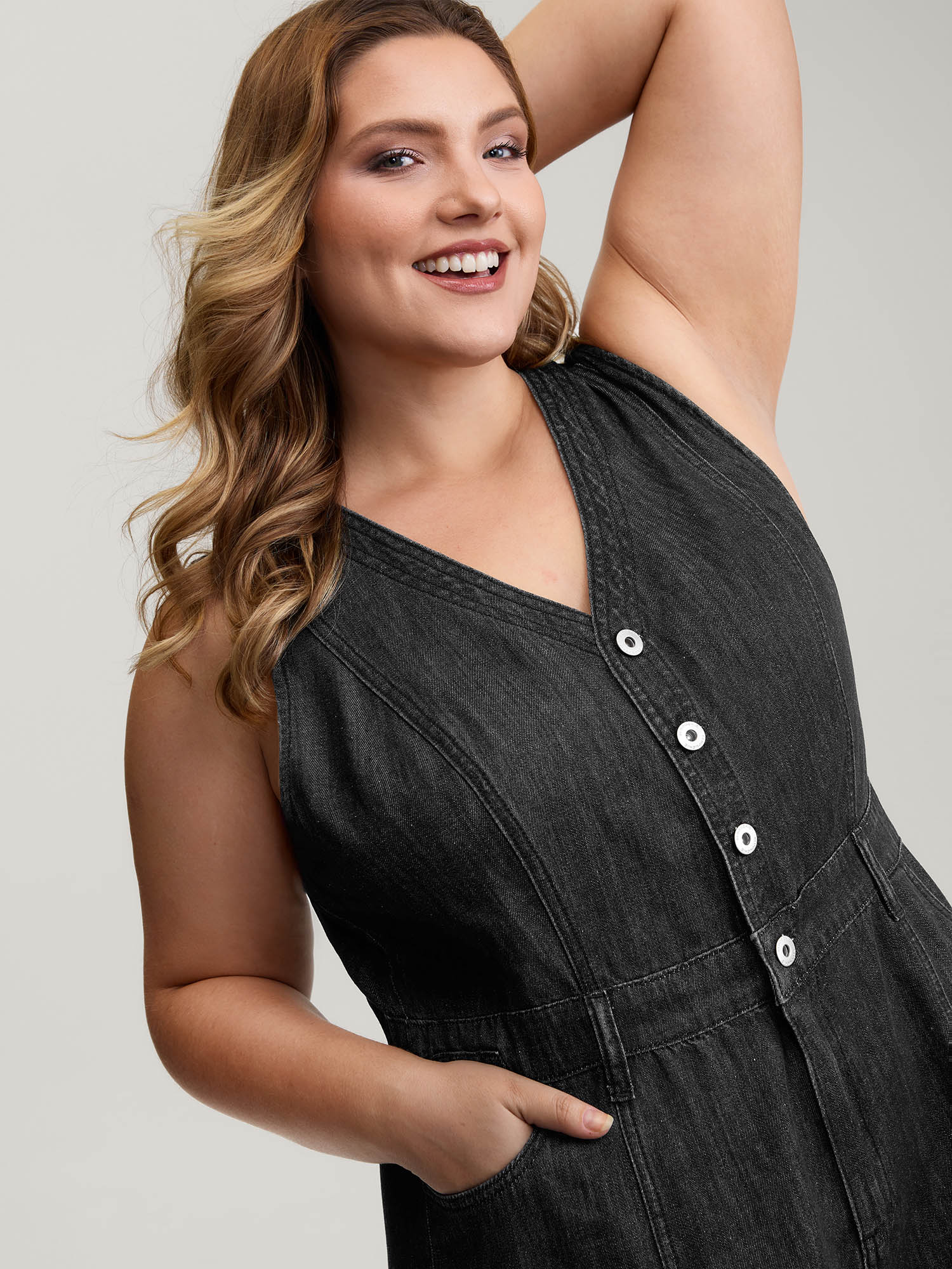 Side view of BloomChic Women's Plus Size Button Placket Pockets Denim Jumpsuit Acidwashblack Casual Button No stretch 26/4X
