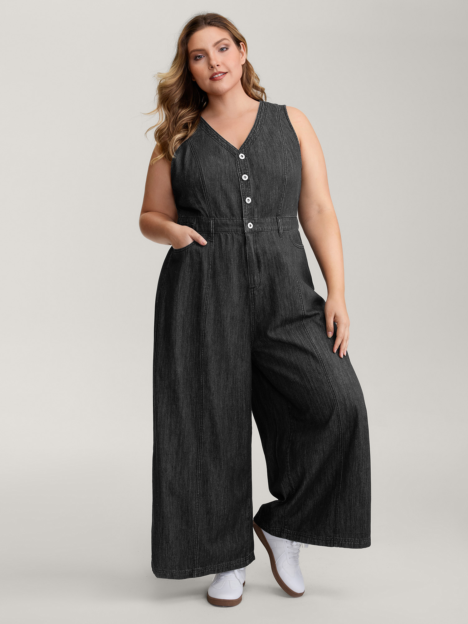 Side view of BloomChic Women's Plus Size Button Placket Pockets Denim Jumpsuit Acidwashblack Casual Button No stretch 26/4X