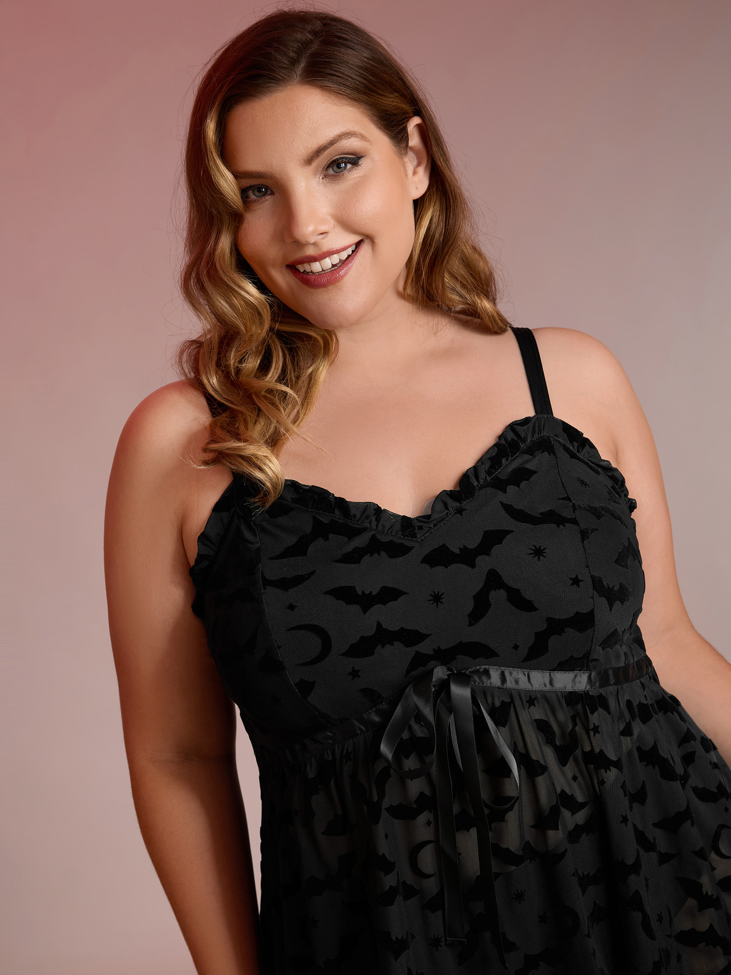 Side view of BloomChic Women's Plus Size Bat Flocked Sheer Ruffled Nightgown Black Sleeveless Tunic 30/6X