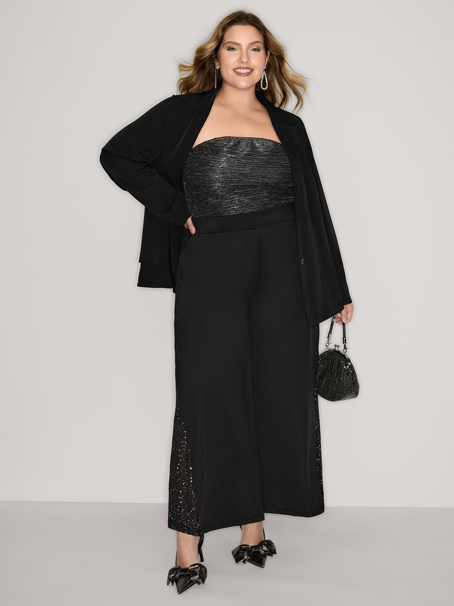 Side view of BloomChic Women's Plus Size Ruffled Hem Double Button Blazer Black Button Sleeve Extra Long Sleeve 14-16/1X