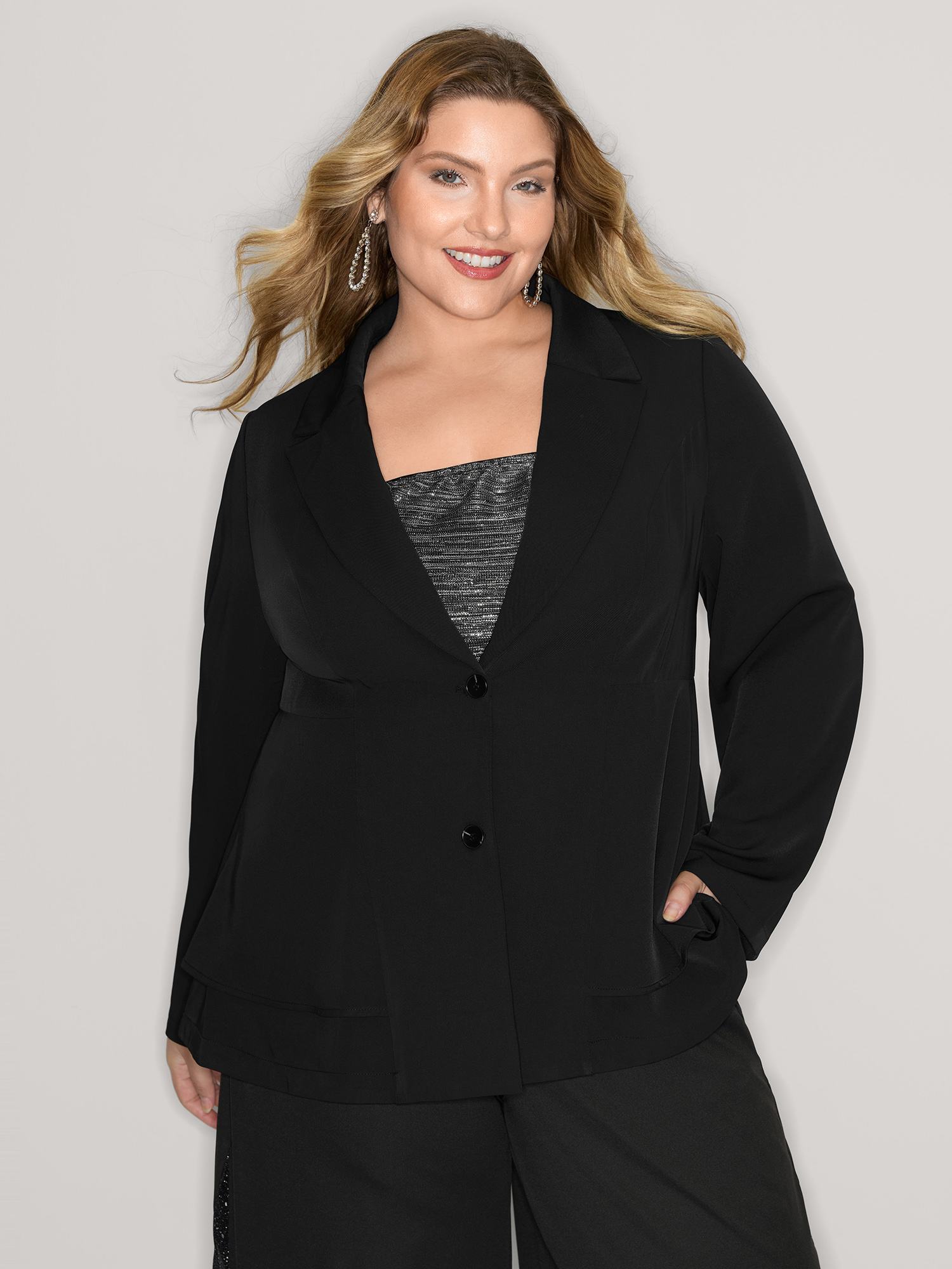 Side view of BloomChic Women's Plus Size Ruffled Hem Double Button Blazer Black Button Sleeve Extra Long Sleeve 14-16/1X