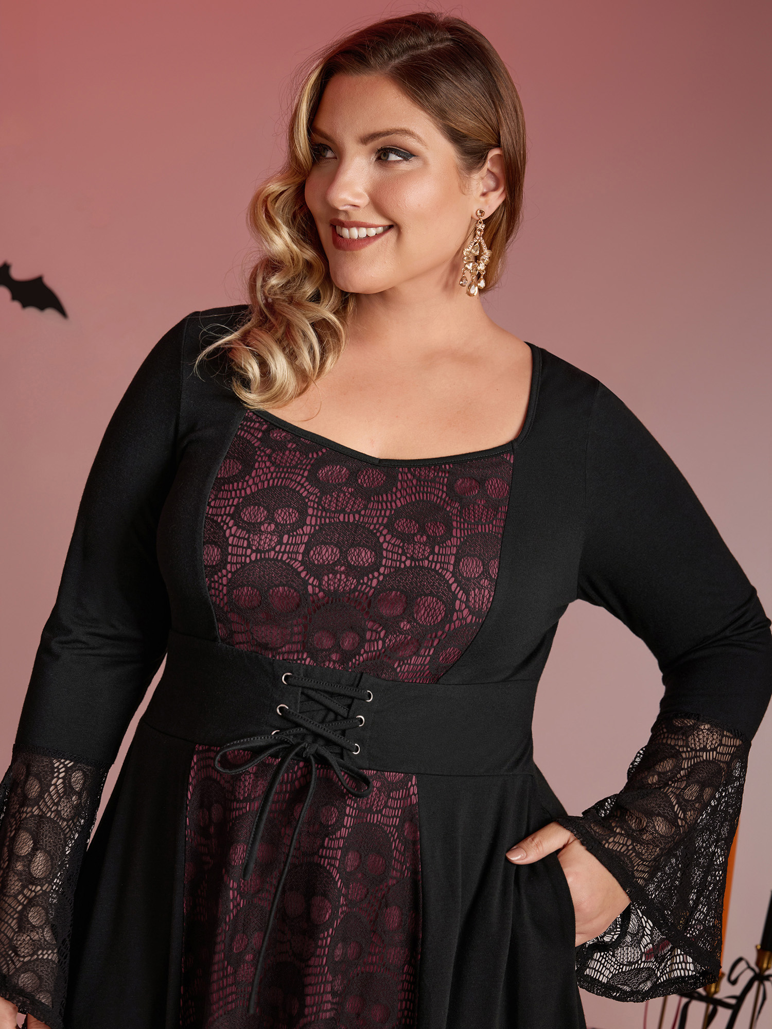 Side view of BloomChic Women's Plus Size Skull Wide-Waist Tie Contrast Midi Dress Black Party 14-16/1X