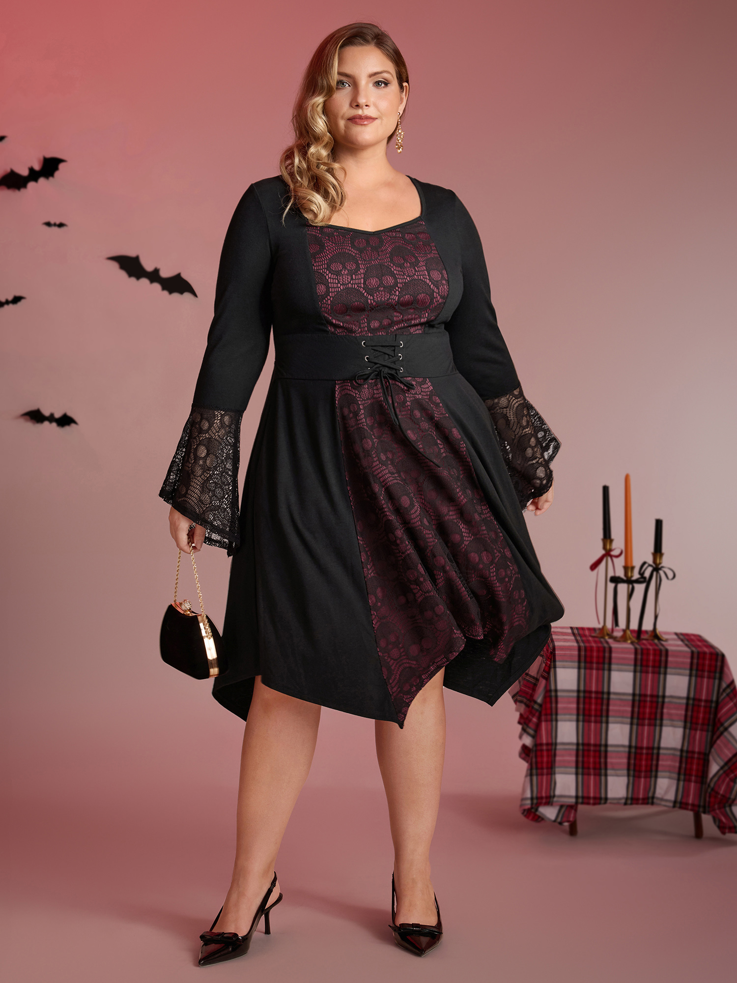 Side view of BloomChic Women's Plus Size Skull Wide-Waist Tie Contrast Midi Dress Black Party 14-16/1X
