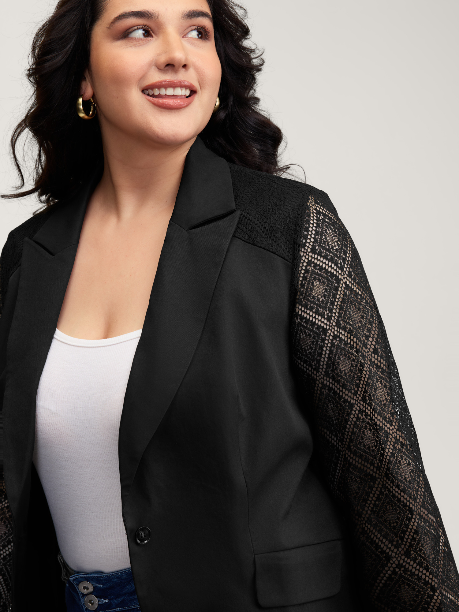 Side view of BloomChic Women's Plus Size Stretchy Textured Sheer Sleeve Contrast Blazer Black See through Sleeve Extra Long Sleeve 22-24/3X