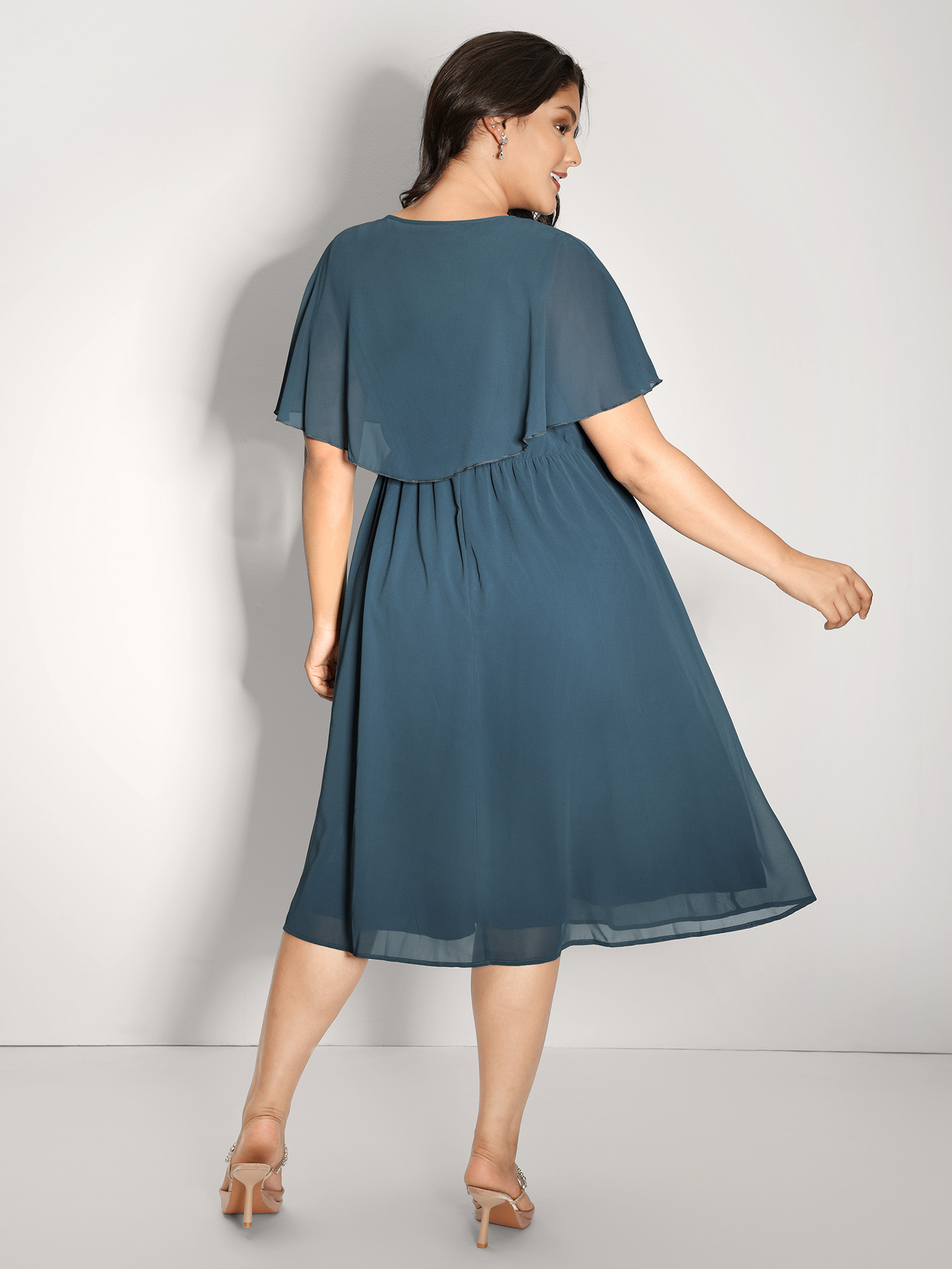 Side view of BloomChic Women's Plus Size Shimmery Hotfix Rhinestone Layered Midi Dress Aegean Party Midi Rhinestone detailing 30/6X