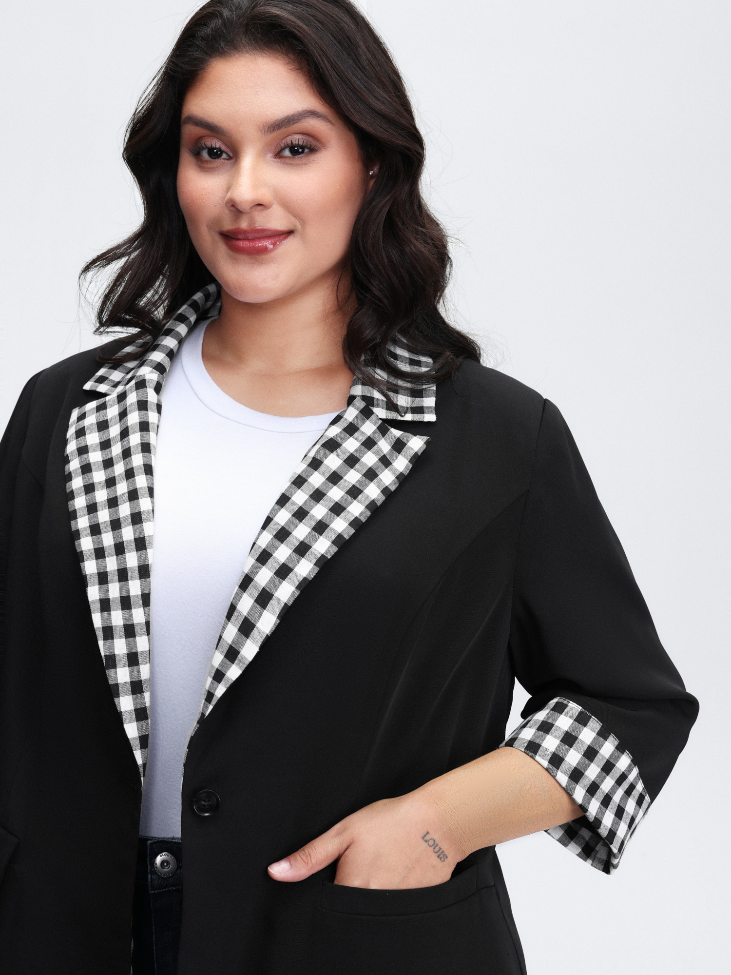 Side view of BloomChic Women's Plus Size Checkered Contrast Button Blazer Black Colorblock Sleeve 3/4 Sleeve 26/4X
