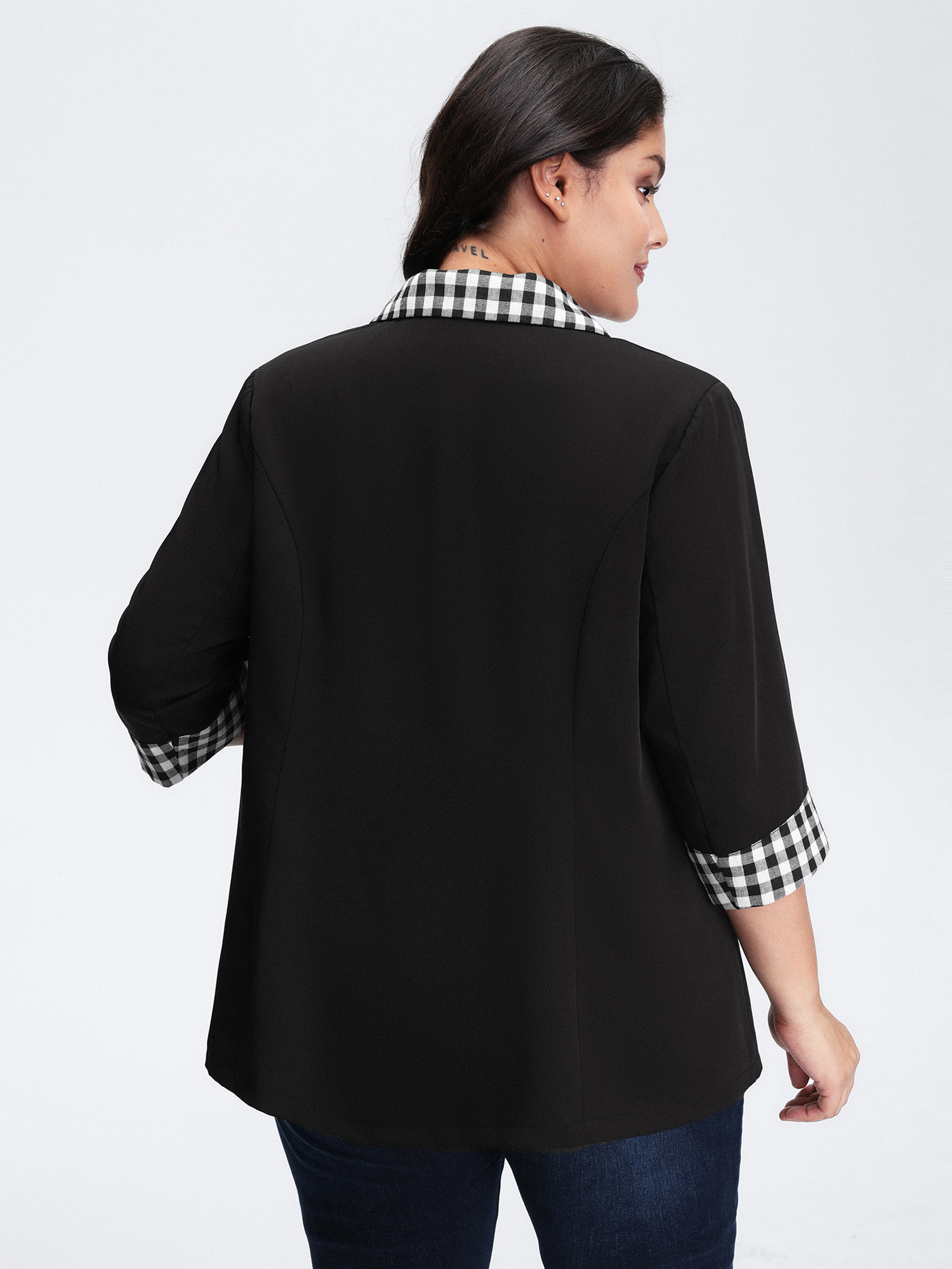 Side view of BloomChic Women's Plus Size Checkered Contrast Button Blazer Black Colorblock Sleeve 3/4 Sleeve 26/4X