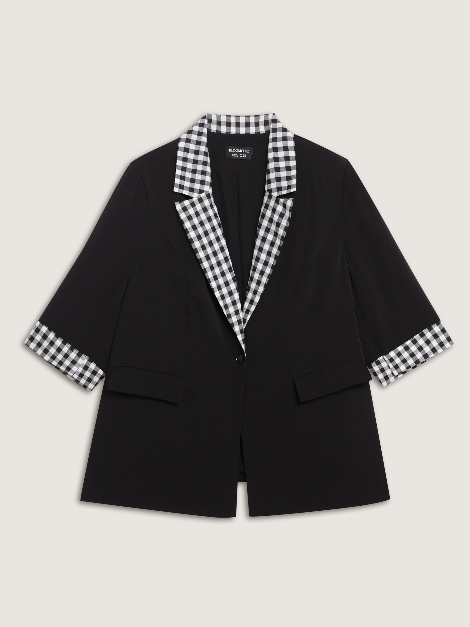 Side view of BloomChic Women's Plus Size Checkered Contrast Button Blazer Black Colorblock Sleeve 3/4 Sleeve 26/4X