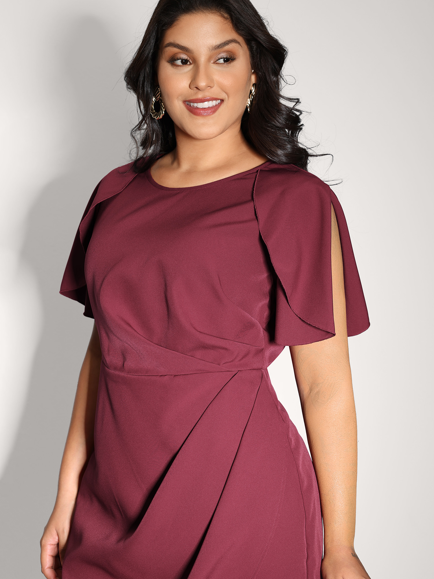Side view of BloomChic Women's Plus Size Wrap Hem Petal Sleeve Midi Dress Plum Party Midi 26/4X
