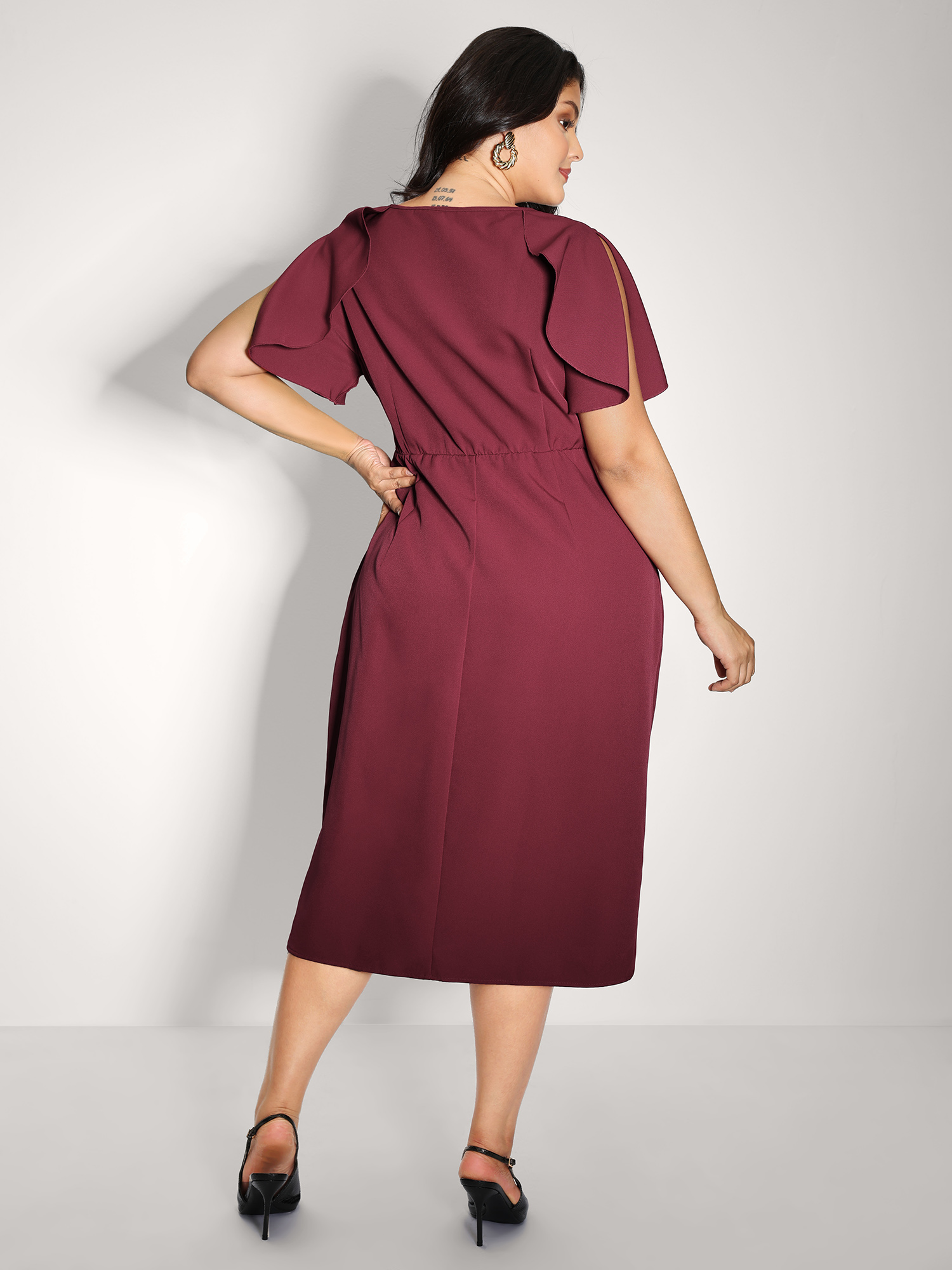 Side view of BloomChic Women's Plus Size Wrap Hem Petal Sleeve Midi Dress Plum Party Midi 26/4X