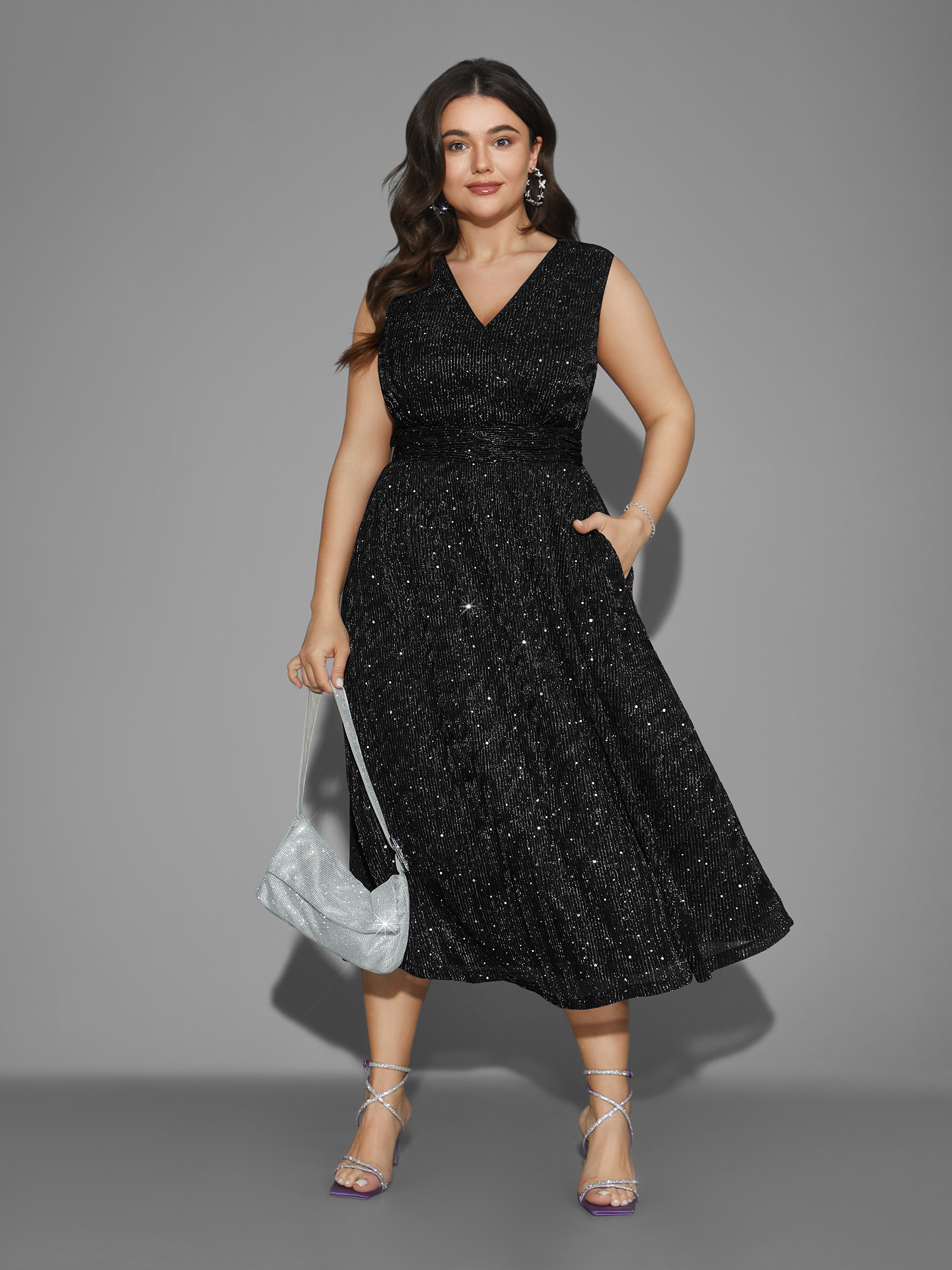 Side view of BloomChic Women's Plus Size Sequin Surplice Neckline Sleeveless Midi Dress Black Party Midi Sequin V-Neck 18-20/2X