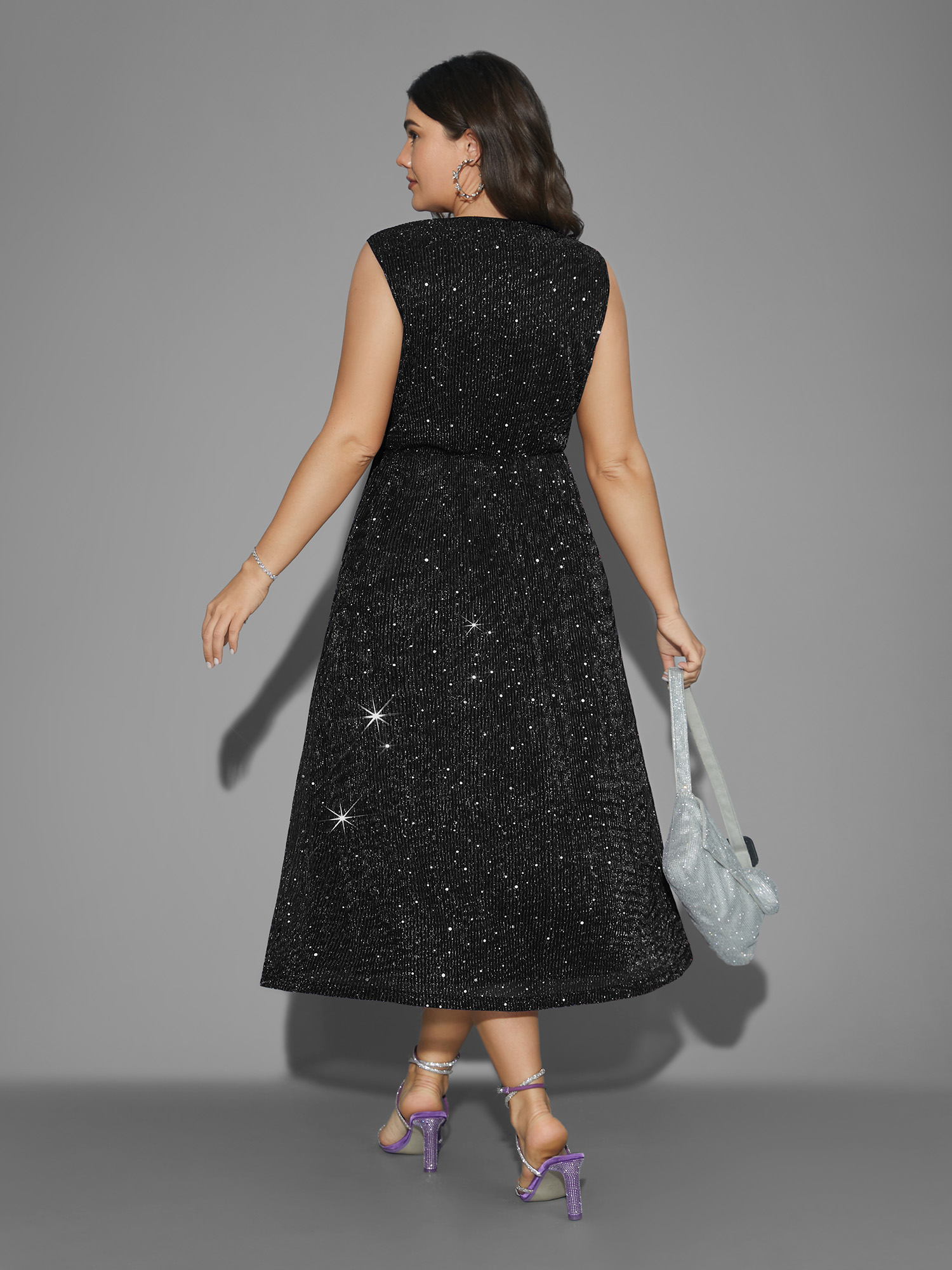 Side view of BloomChic Women's Plus Size Sequin Surplice Neckline Sleeveless Midi Dress Black Party Midi Sequin V-Neck 18-20/2X