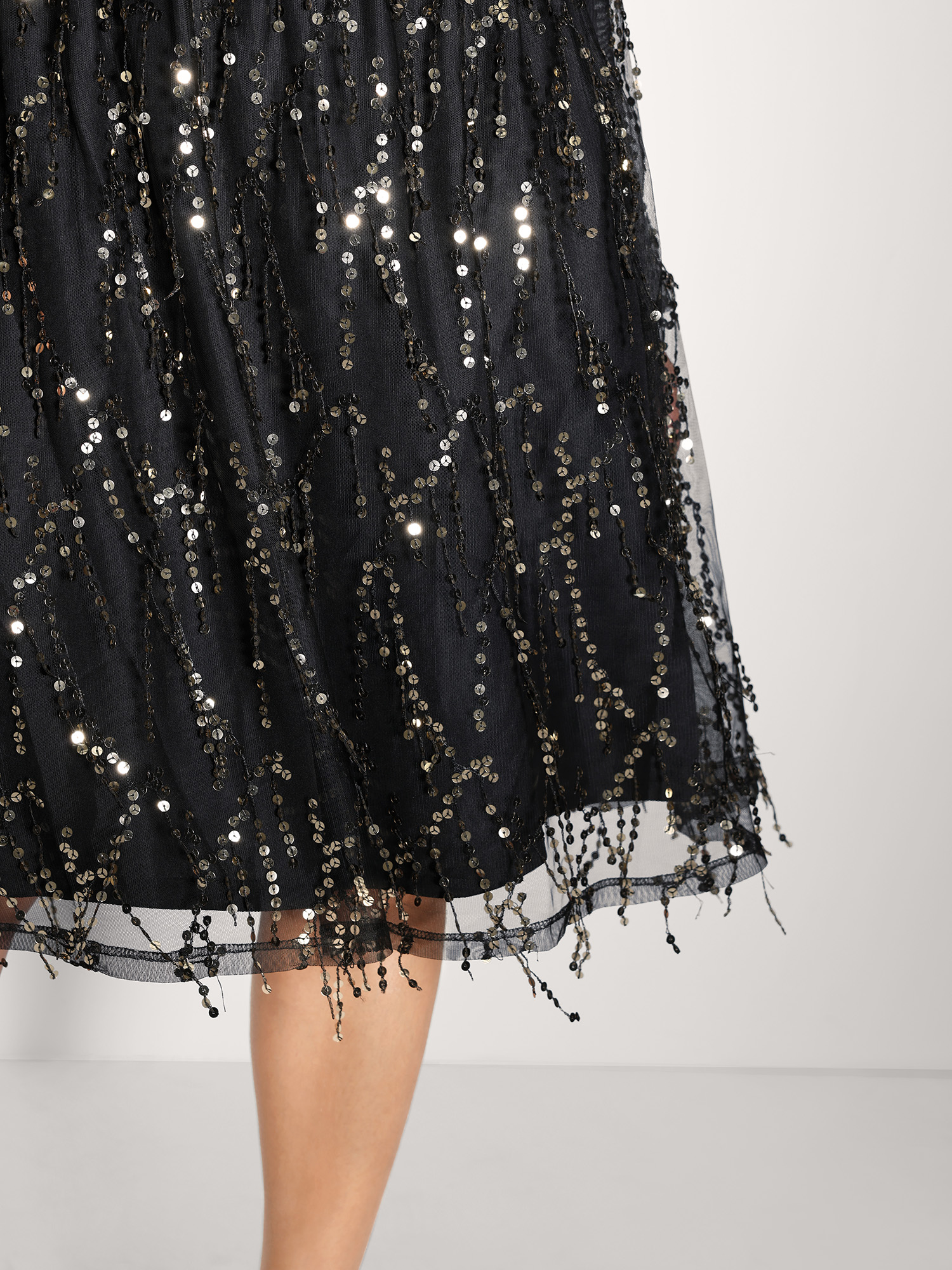 Side view of BloomChic Women's Plus Size Back Bow Tie Fringe Sequin Mini Dress Black Party Midi Ruched Round Neck 12/L