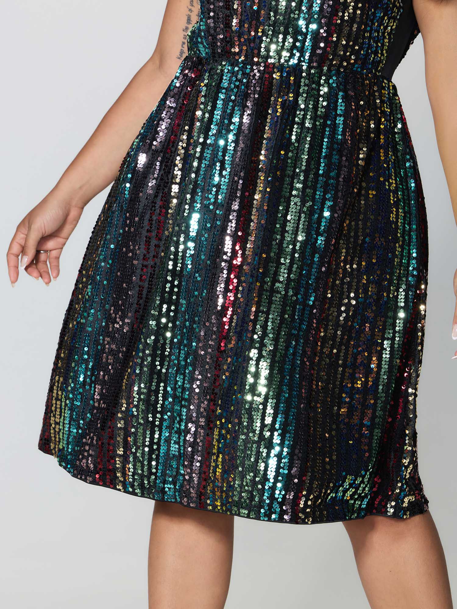 Side view of BloomChic Women's Plus Size Shimmery Sequin Stripe Cinched-Waist Mini Dress Multicolor Party Sequin 14-16/1X