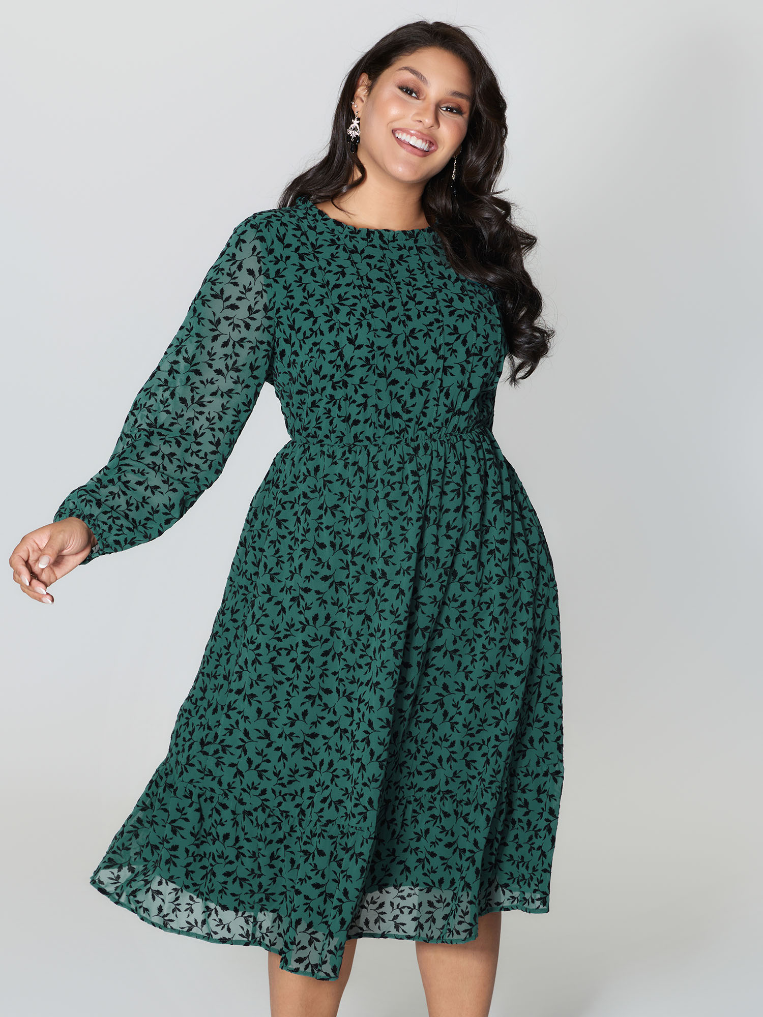 Side view of BloomChic Women's Plus Size Flocked Floral Shirred Ruffled Neck Midi Dress Teal Elegant Midi Ruched Round Neck 30/6X