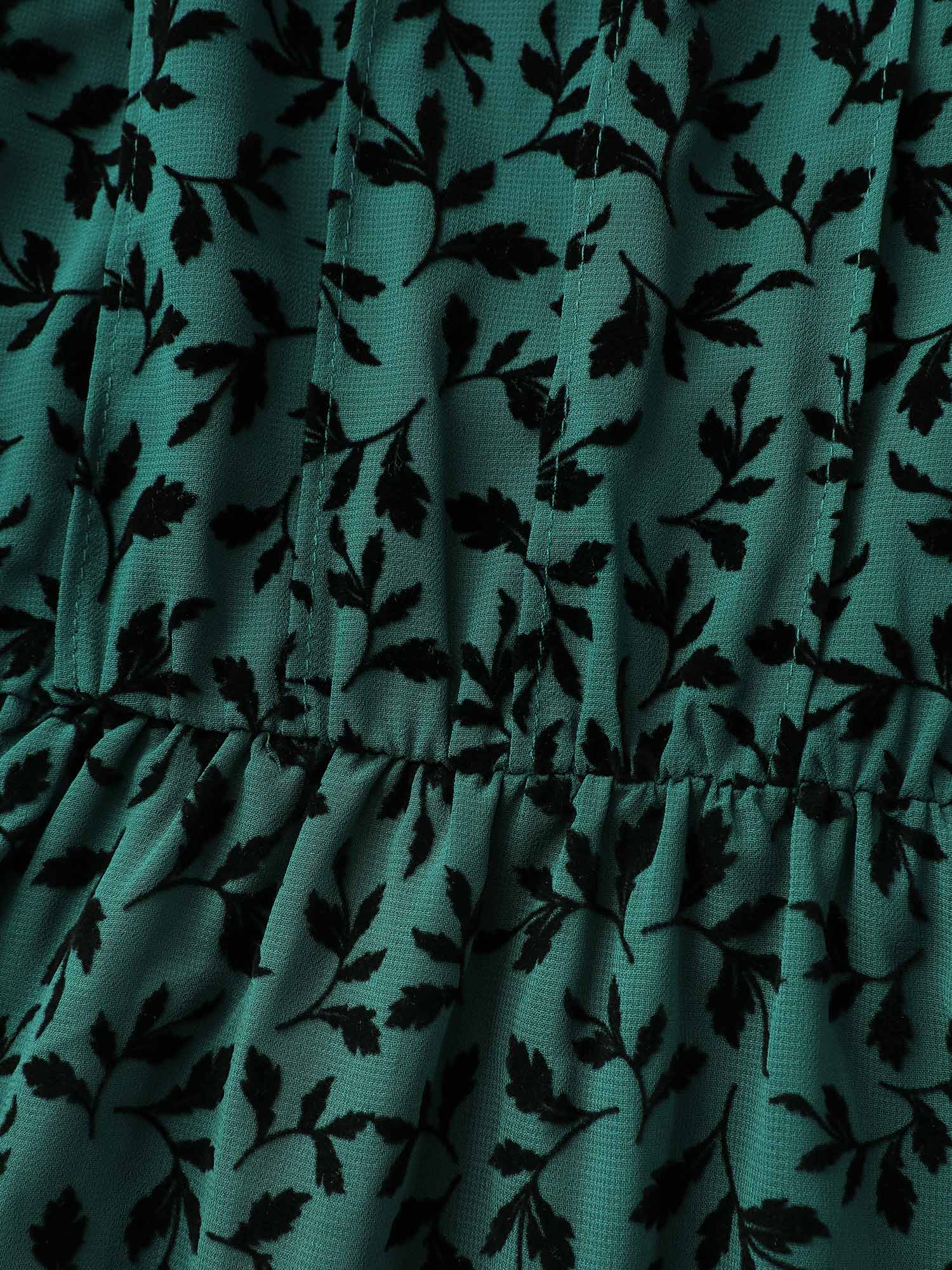 Side view of BloomChic Women's Plus Size Flocked Floral Shirred Ruffled Neck Midi Dress Teal Elegant Midi Ruched Round Neck 30/6X