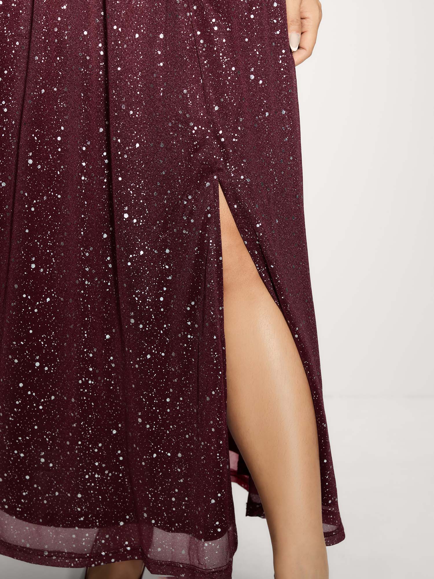 Side view of BloomChic Women's Plus Size Shimmery Hot Stamp Stretchy Slit Maxi Dress Burgundy Party Maxi Sequin 30/6X