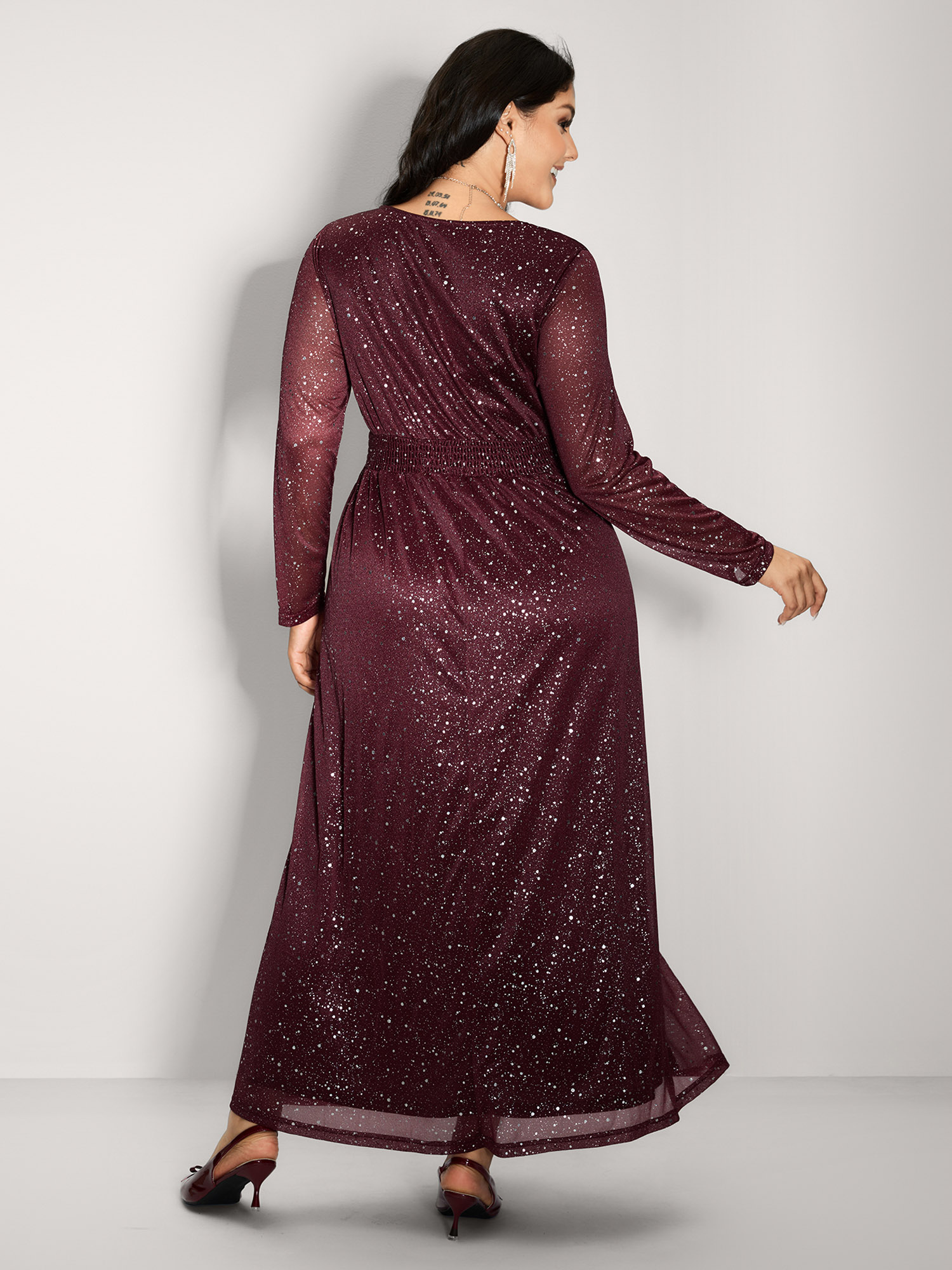 Side view of BloomChic Women's Plus Size Shimmery Hot Stamp Stretchy Slit Maxi Dress Burgundy Party Maxi Sequin 30/6X