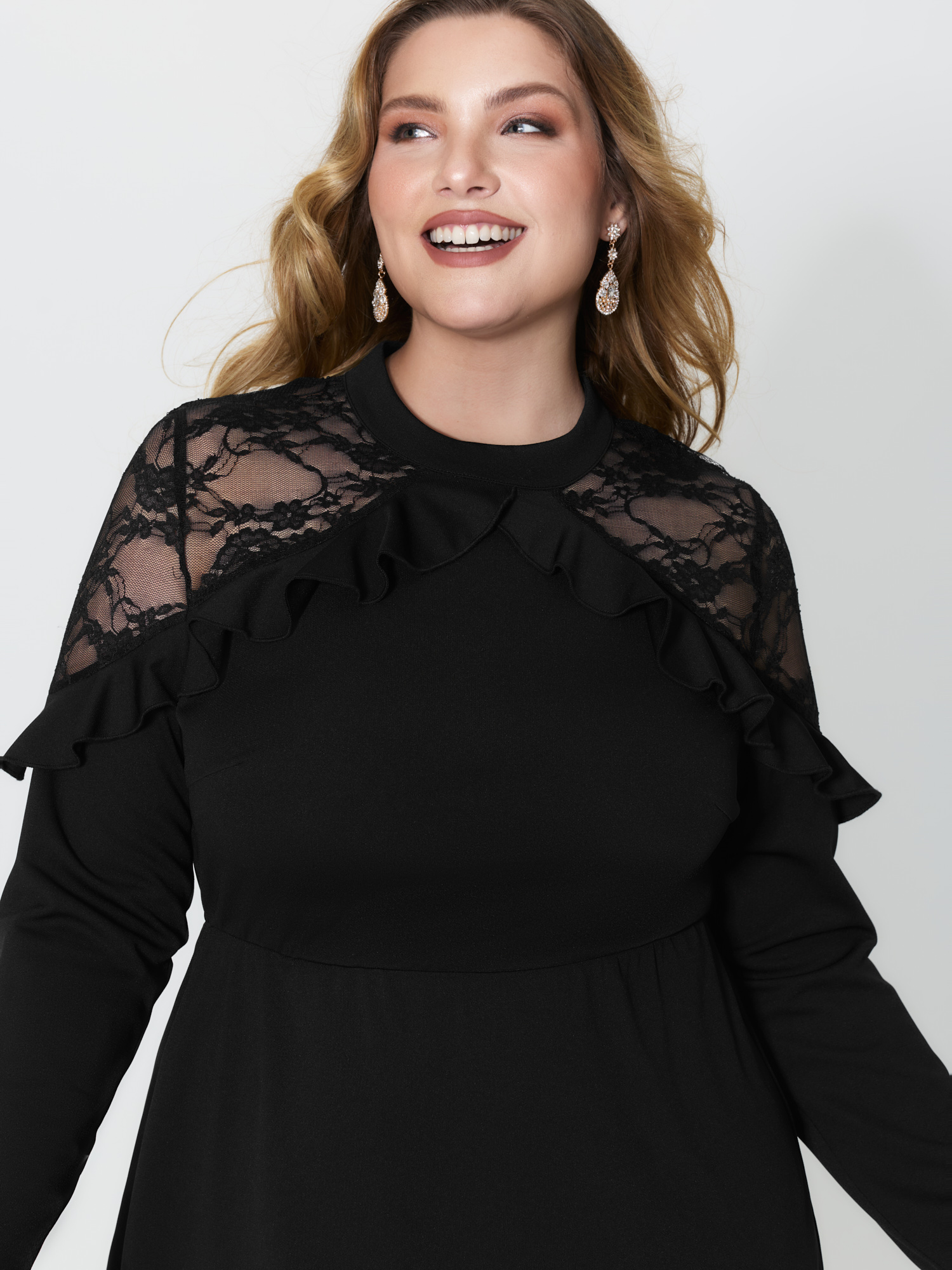 Side view of BloomChic Women's Plus Size Lace Trim Ruffled Sheer Stretchy Party Dress Black Party Midi 10/M