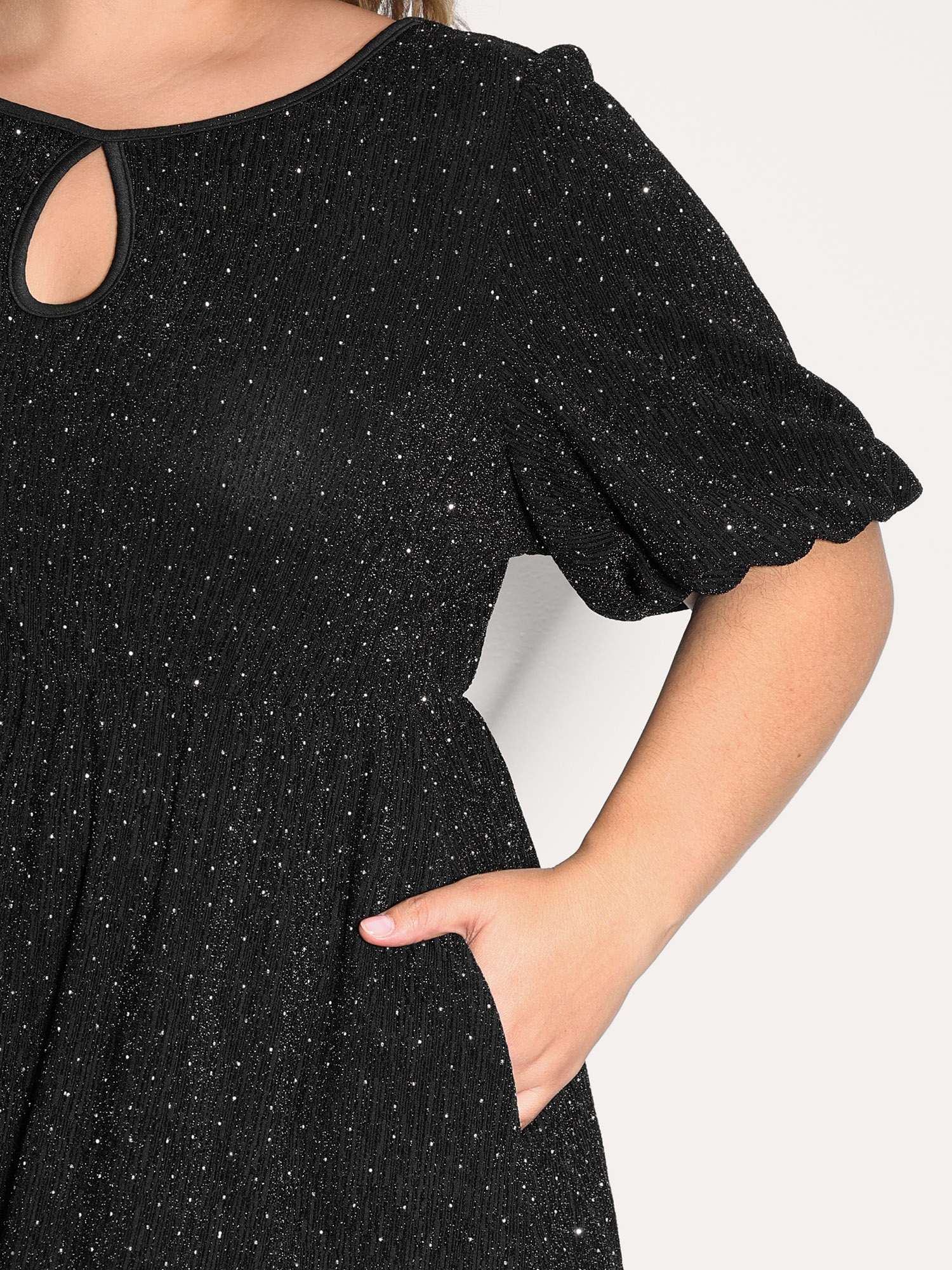 Side view of BloomChic Women's Plus Size Bowknot Rhinestone Pockets Mini Dress Black Party Knee 12/L