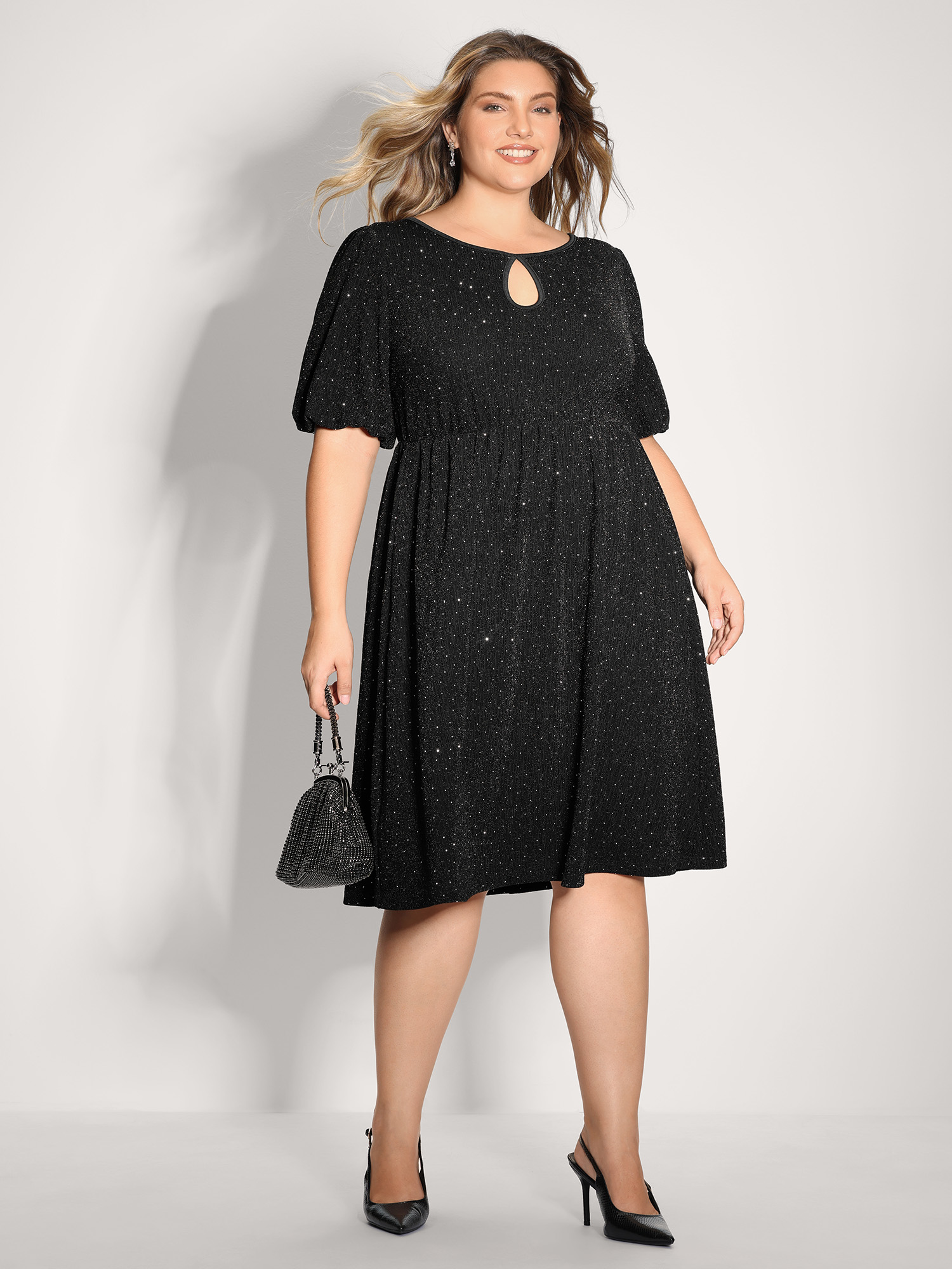 Side view of BloomChic Women's Plus Size Bowknot Rhinestone Pockets Mini Dress Black Party Knee 12/L