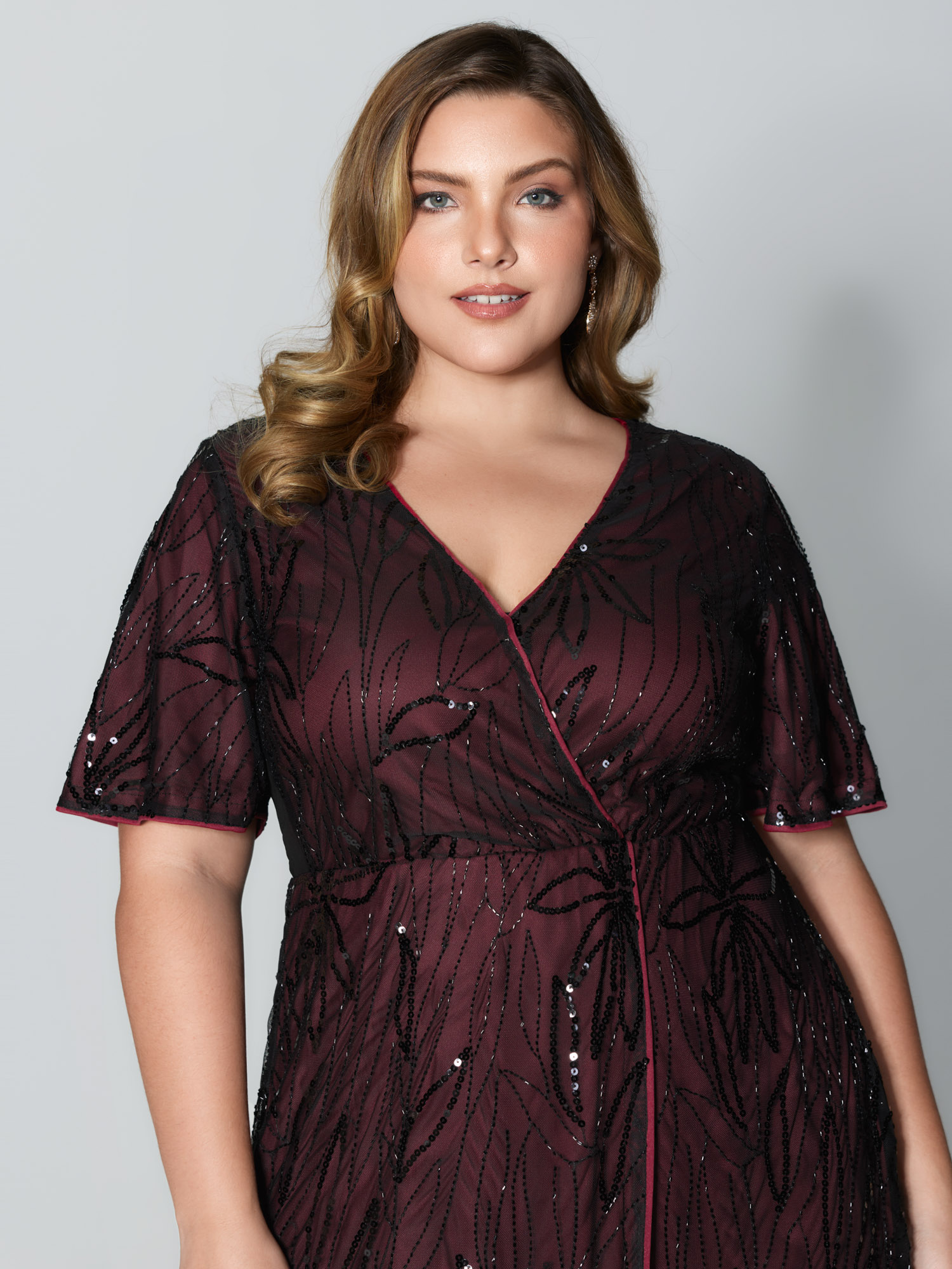 Side view of BloomChic Women's Plus Size Shimmery Sequin Embroidery Pockets Party Dress Burgundy Party Midi 22-24/3X