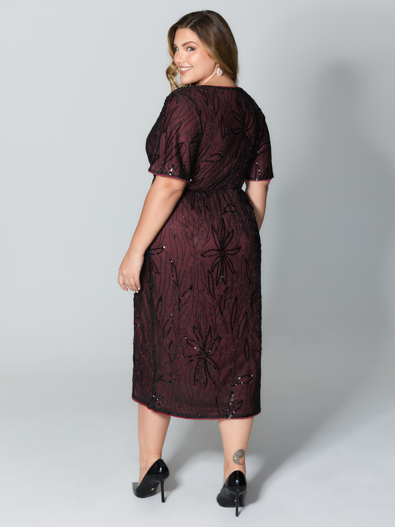Side view of BloomChic Women's Plus Size Shimmery Sequin Embroidery Pockets Party Dress Burgundy Party Midi 22-24/3X