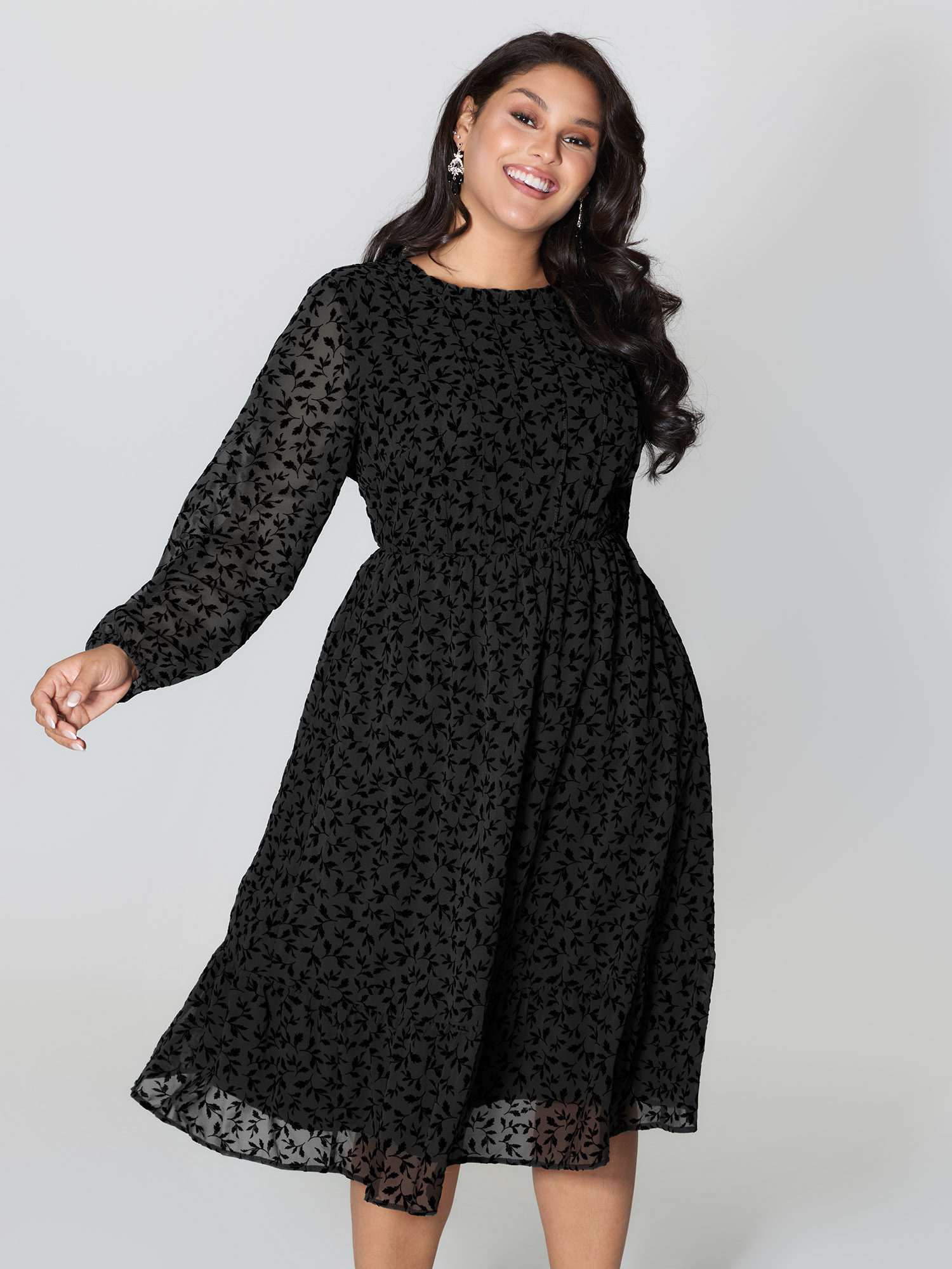 Side view of BloomChic Women's Plus Size Flocked Floral Shirred Ruffled Neck Midi Dress Black Elegant Midi Ruched Round Neck 26/4X