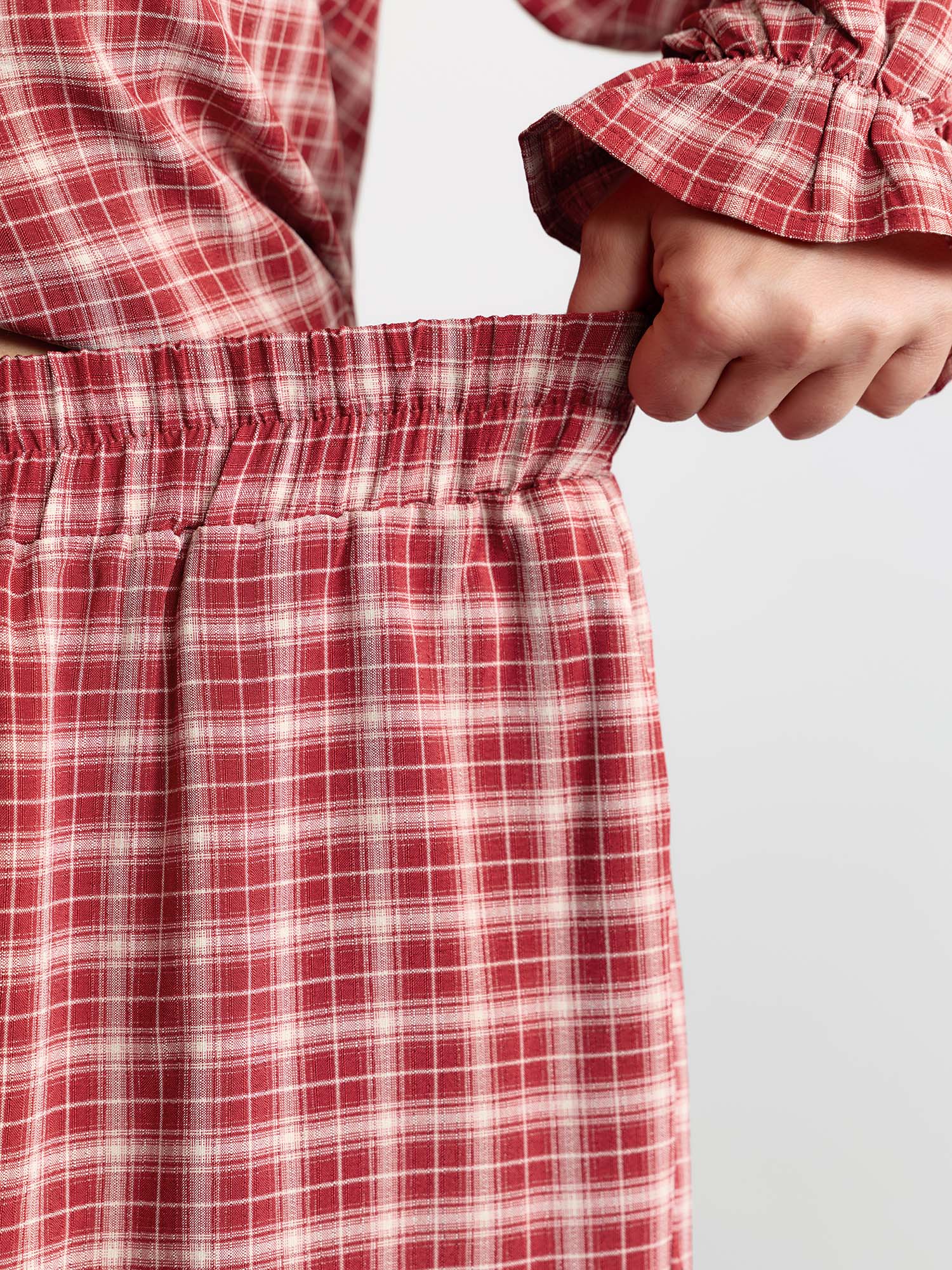 Side view of BloomChic Women's Plus Size Gingham Print Ruffled Hem Co-Ord Pajama Set Crimson not graphics 22-24/3X