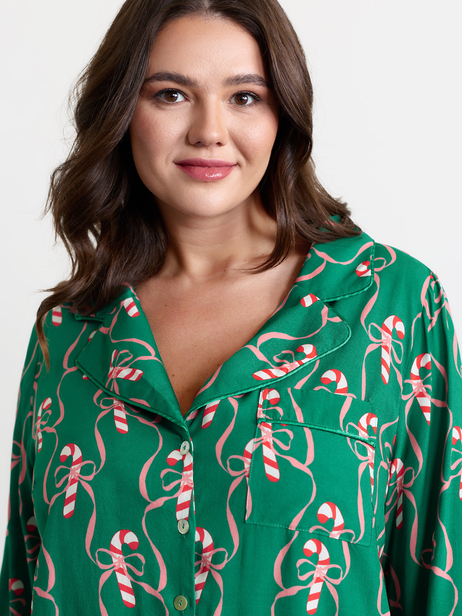 Side view of BloomChic Women's Plus Size Holiday Cheer Print Pockets Two-Piece Lounge Set Emerald Christmas Long Sleeve Non 18-20/2X