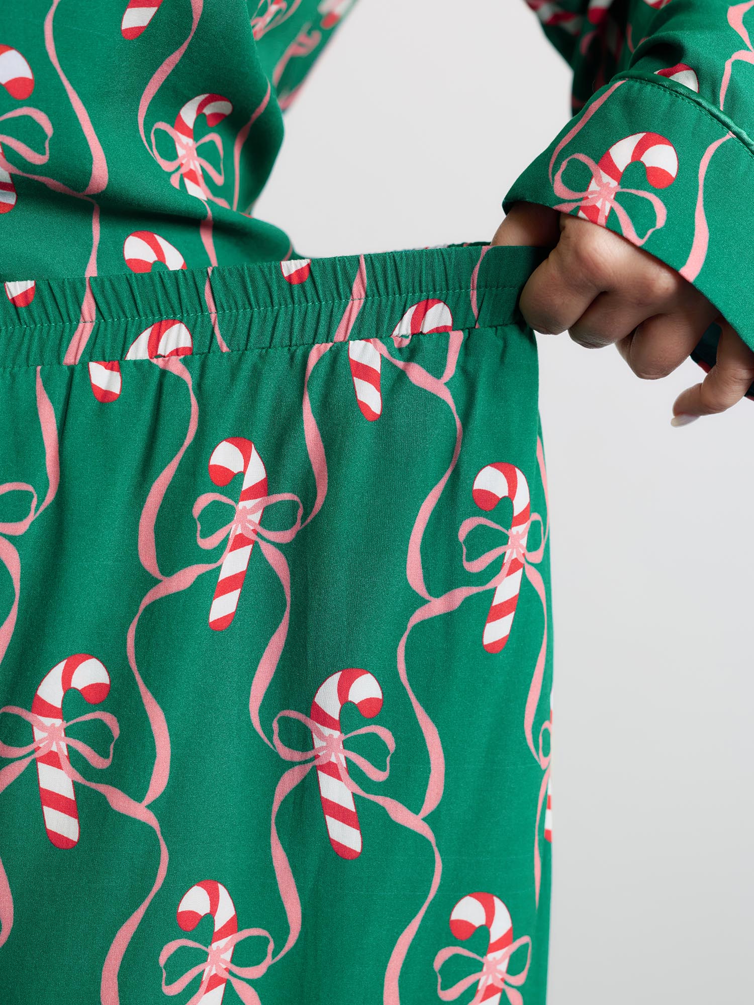 Side view of BloomChic Women's Plus Size Holiday Cheer Print Pockets Two-Piece Lounge Set Emerald Christmas Long Sleeve Non 18-20/2X