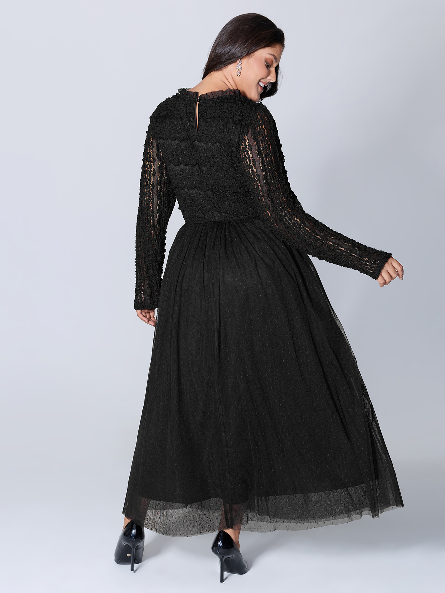 Side view of BloomChic Women's Plus Size Textured Lace Sheer Lined Maxi Dress Black Elegant Patchwork Mock Neck 12/L