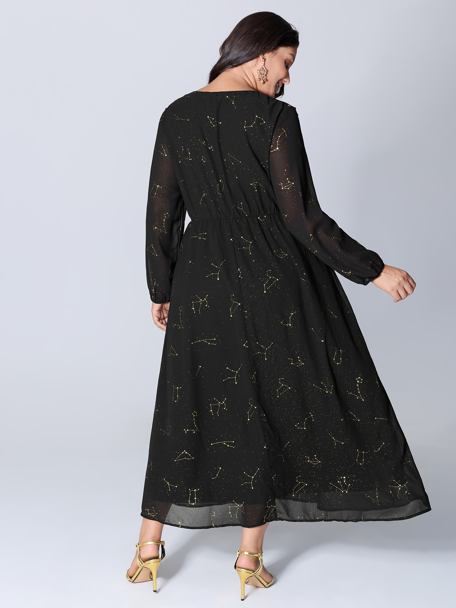 Side view of BloomChic Women's Plus Size Shimmery Hot Stamped Shirred Pockets Party Dress Black Party Maxi 10/M