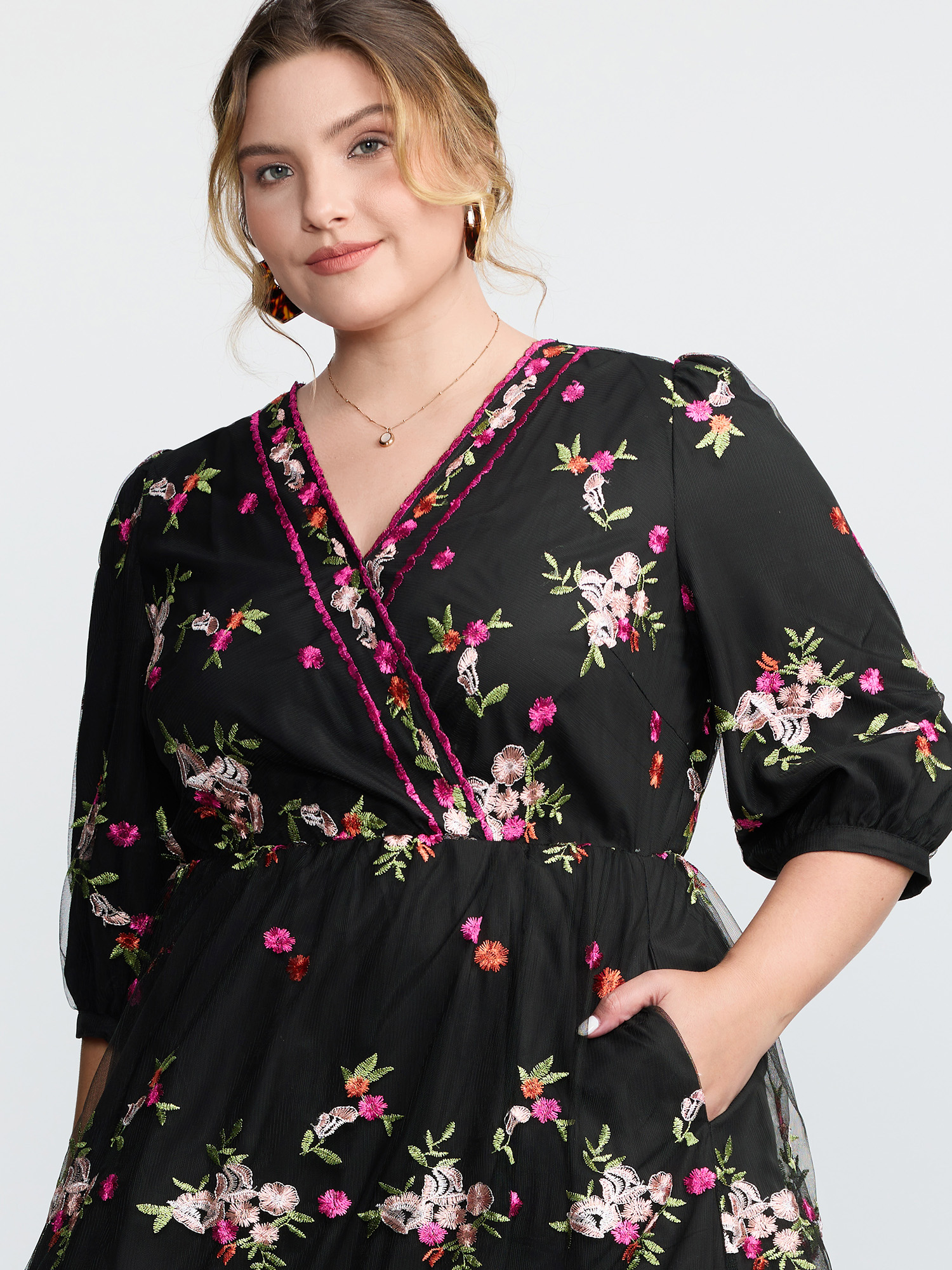 Side view of BloomChic Women's Plus Size Floral Embroidered Mesh Lined Party Dress Black Elegant Maxi 30/6X