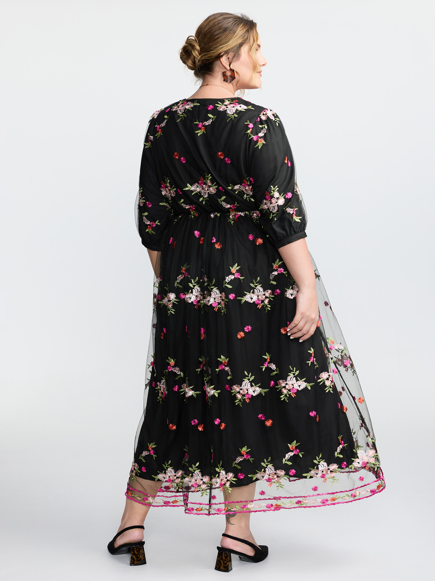 Side view of BloomChic Women's Plus Size Floral Embroidered Mesh Lined Party Dress Black Elegant Maxi 30/6X