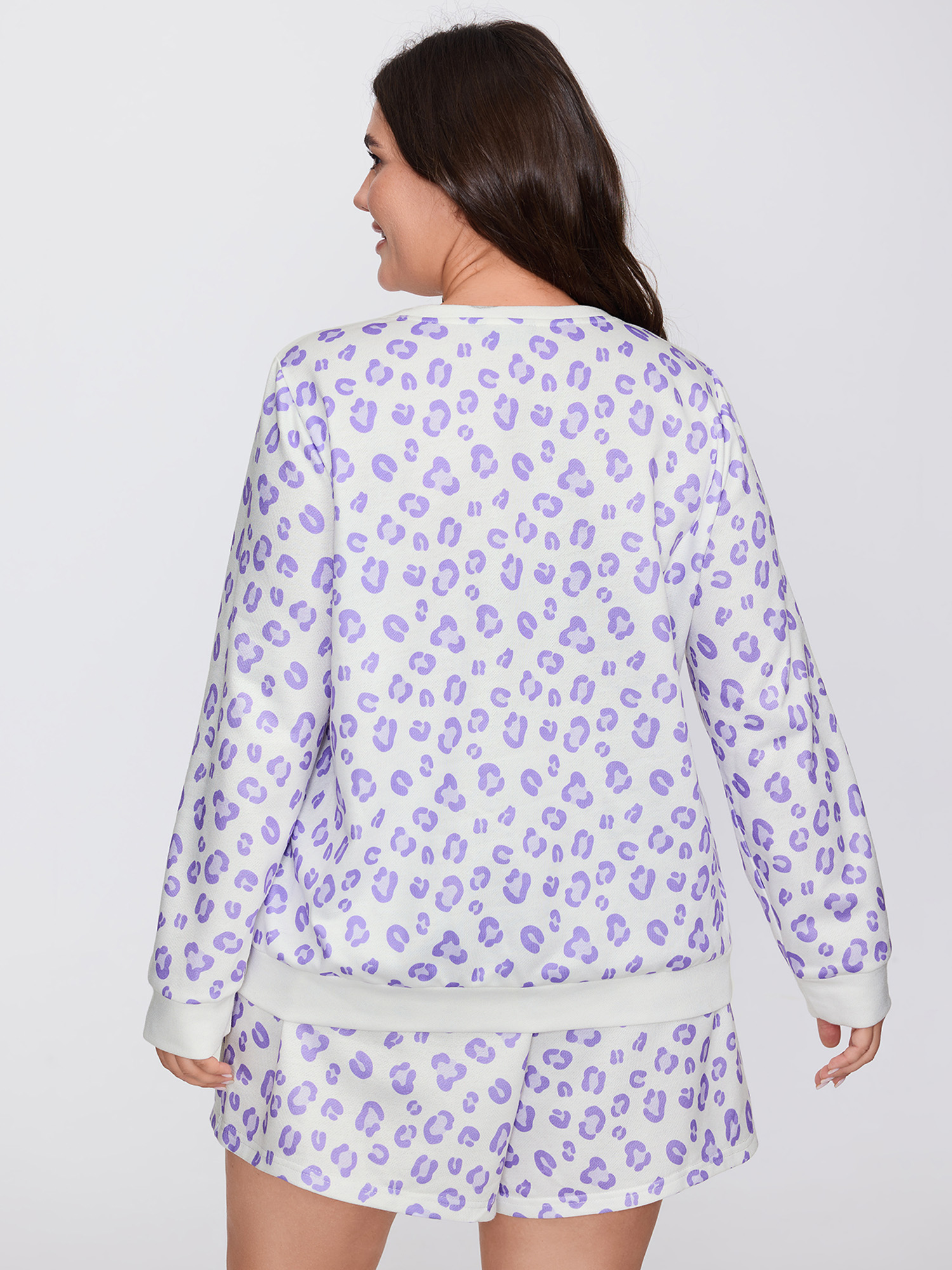 Side view of BloomChic Women's Plus Size Cozy Leopard Print Contrast Loungewear Set Originalwhite Animal Motif Long Sleeve Colorblock 30/6X
