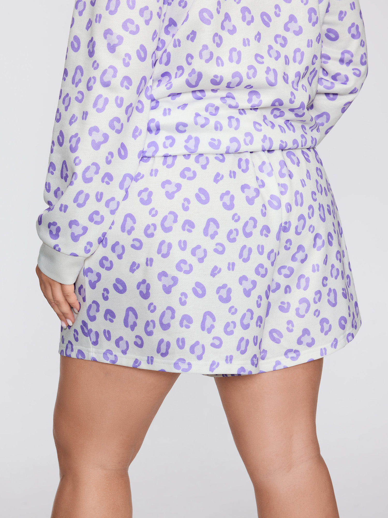 Side view of BloomChic Women's Plus Size Cozy Leopard Print Contrast Loungewear Set Originalwhite Animal Motif Long Sleeve Colorblock 30/6X