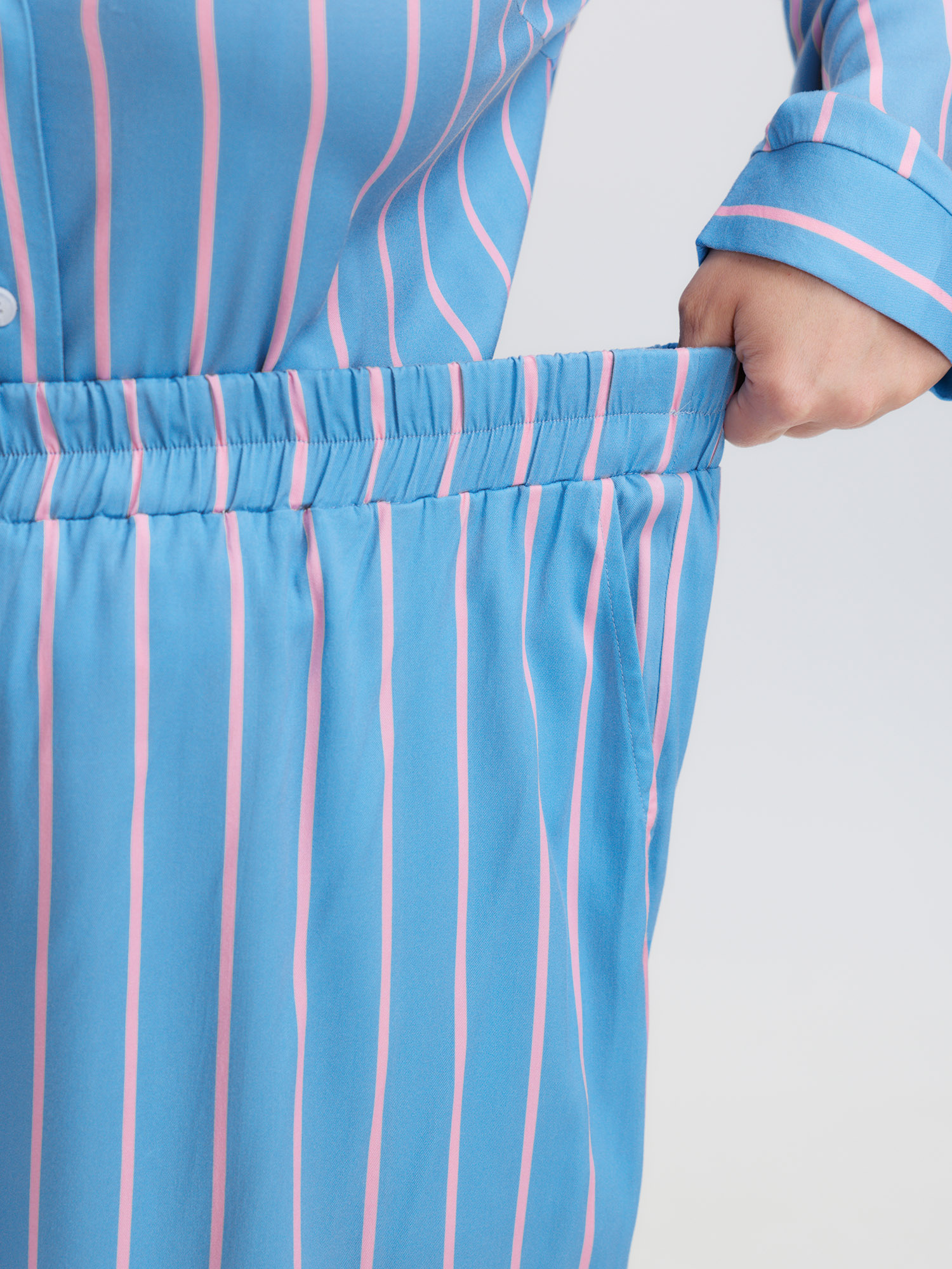 Side view of BloomChic Women's Plus Size Stripe Print Pockets Two-Piece Pajama Set LightBlue 10/M