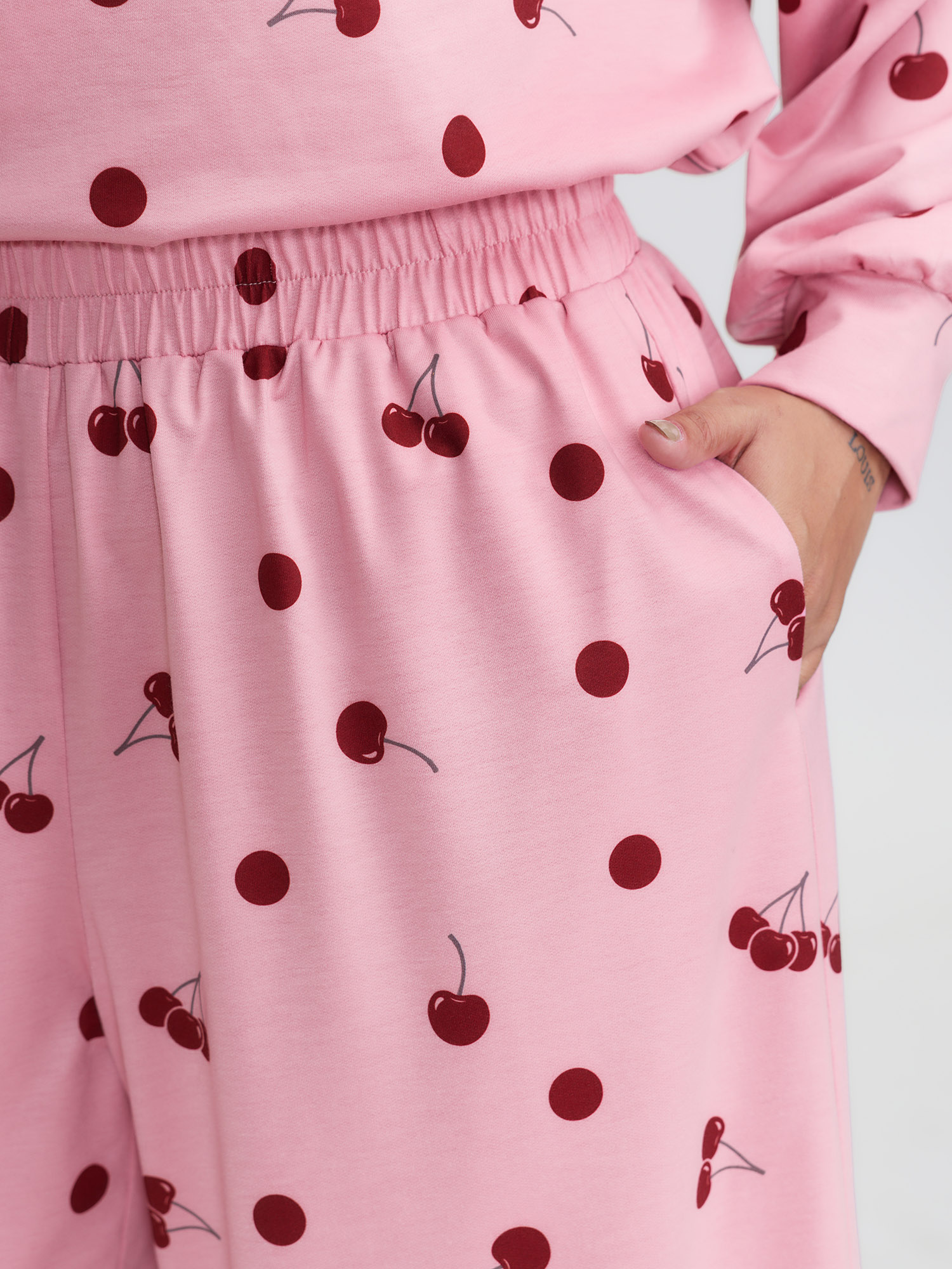 Side view of BloomChic Women's Plus Size Playful Cherry Print Loungewear Set Rouge Fruit and vegetable print Extra Long Sleeve 10/M