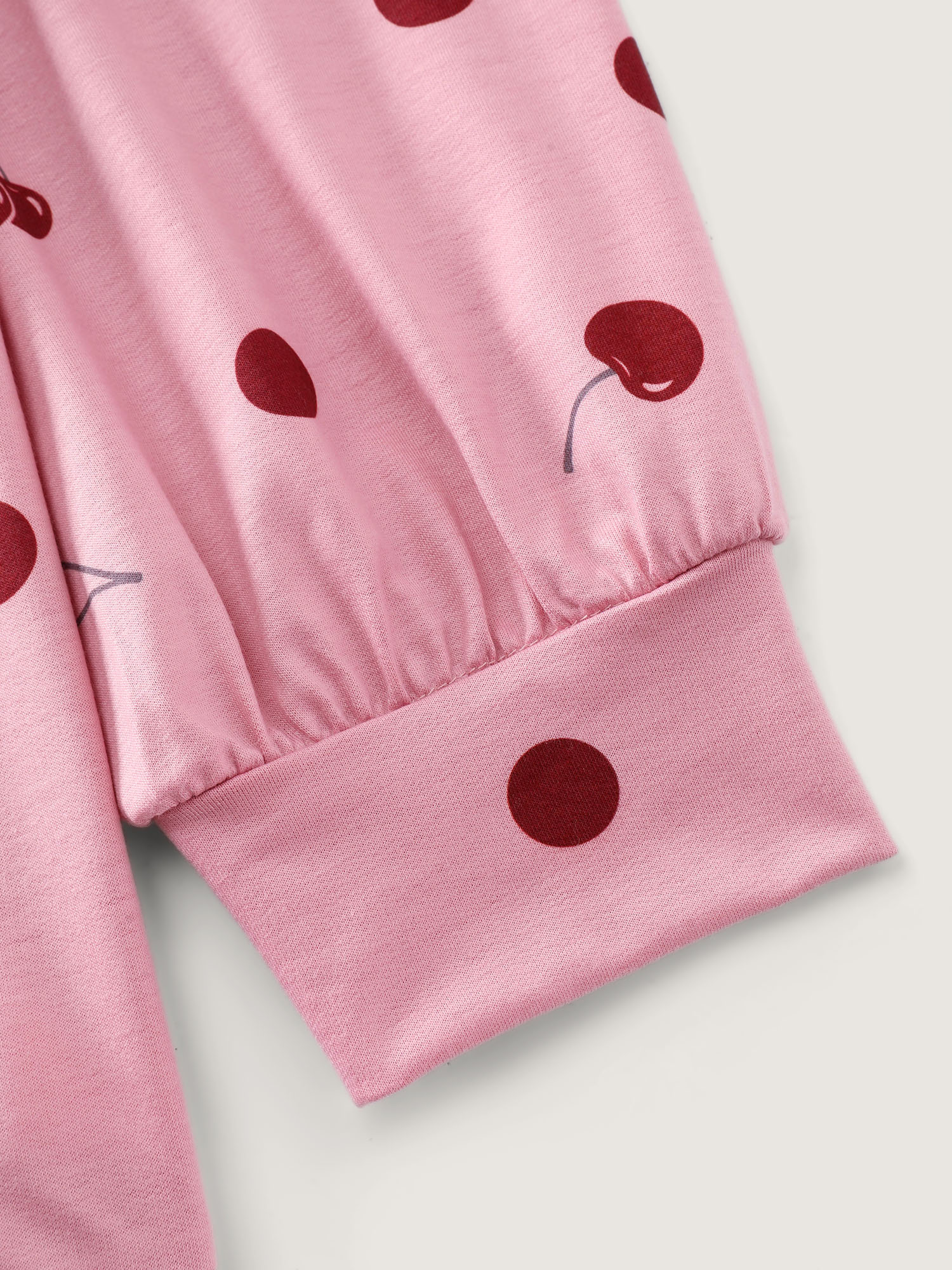 Side view of BloomChic Women's Plus Size Playful Cherry Print Loungewear Set Rouge Fruit and vegetable print Extra Long Sleeve 10/M