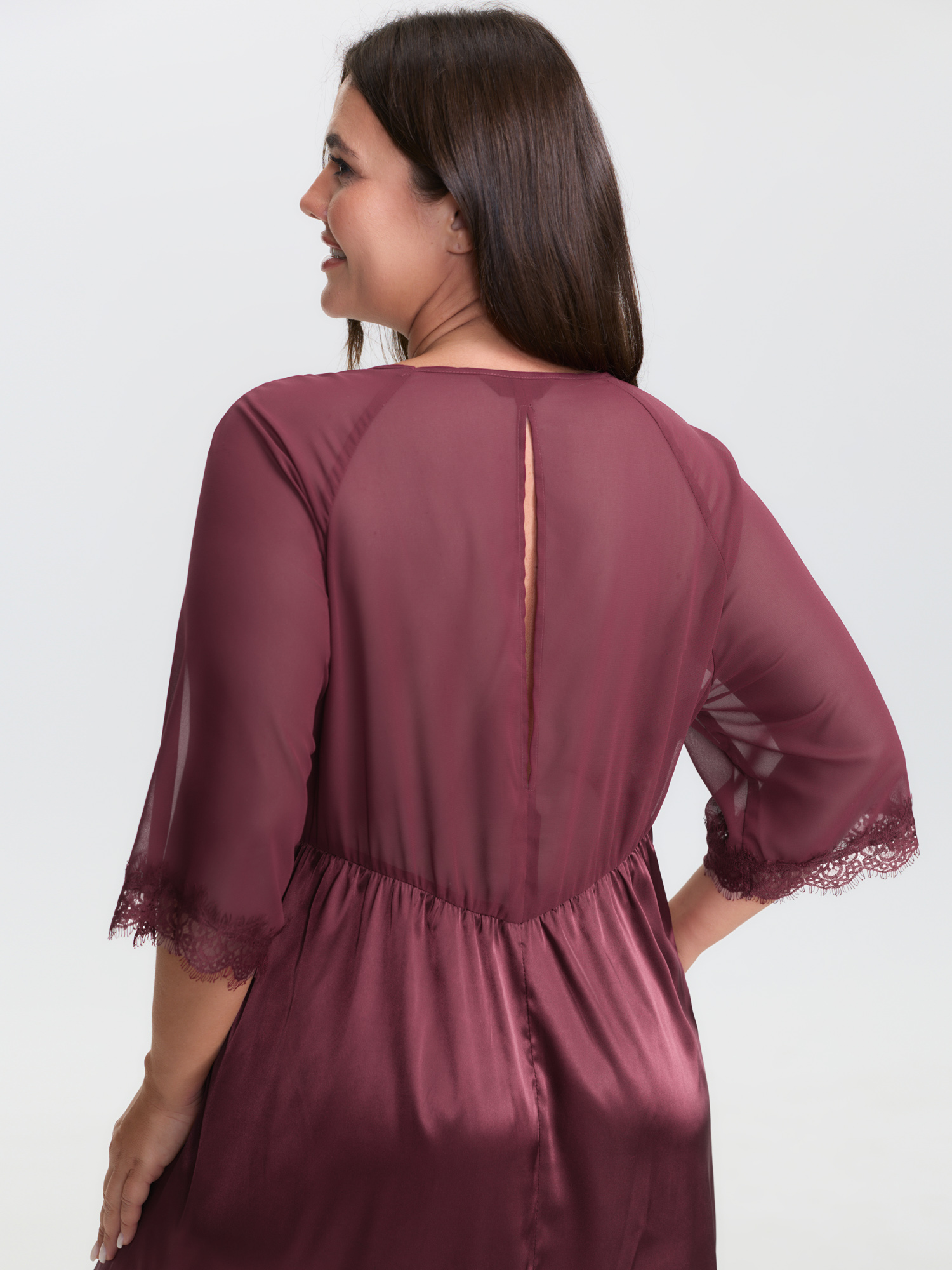Side view of BloomChic Women's Plus Size Satin Semi-Sheer Sleeve Pleated Nightgown Burgundy Half Sleeve Knee 22-24/3X